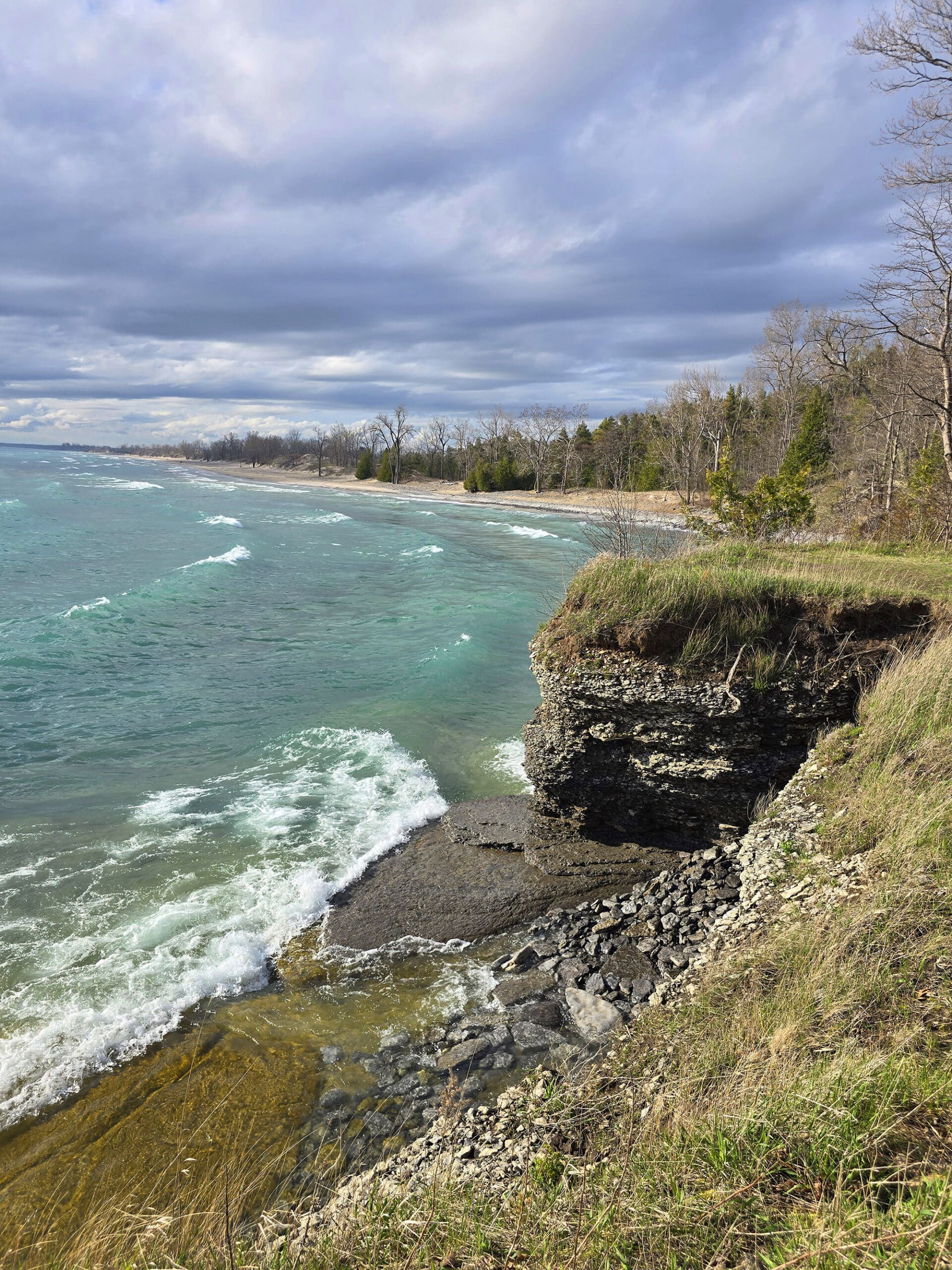 A view over Lakeshore Beach at Sandbanks Provincial Park on a sunny day.