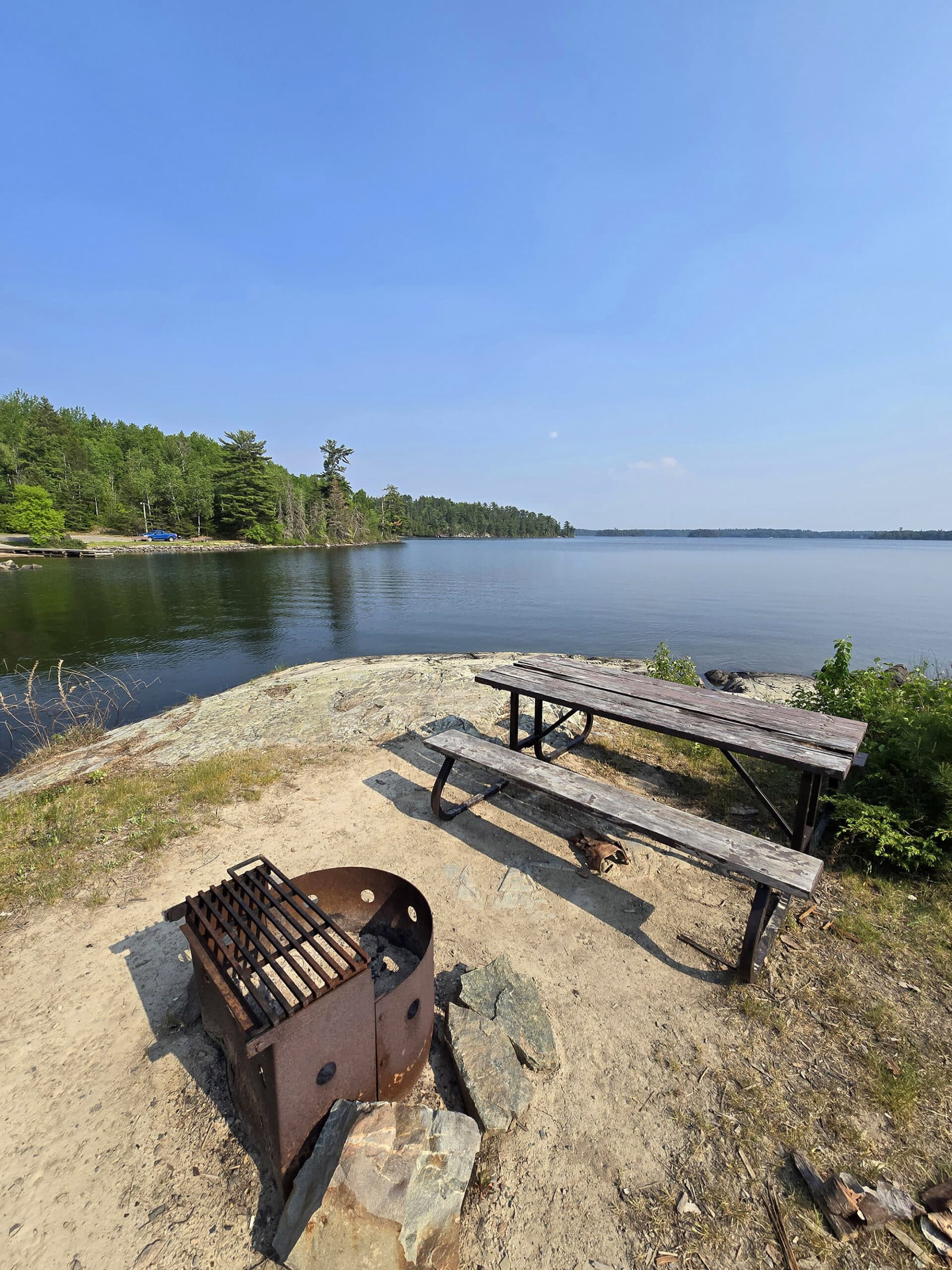 A campsite on a rock, overlooking lake of the woods.