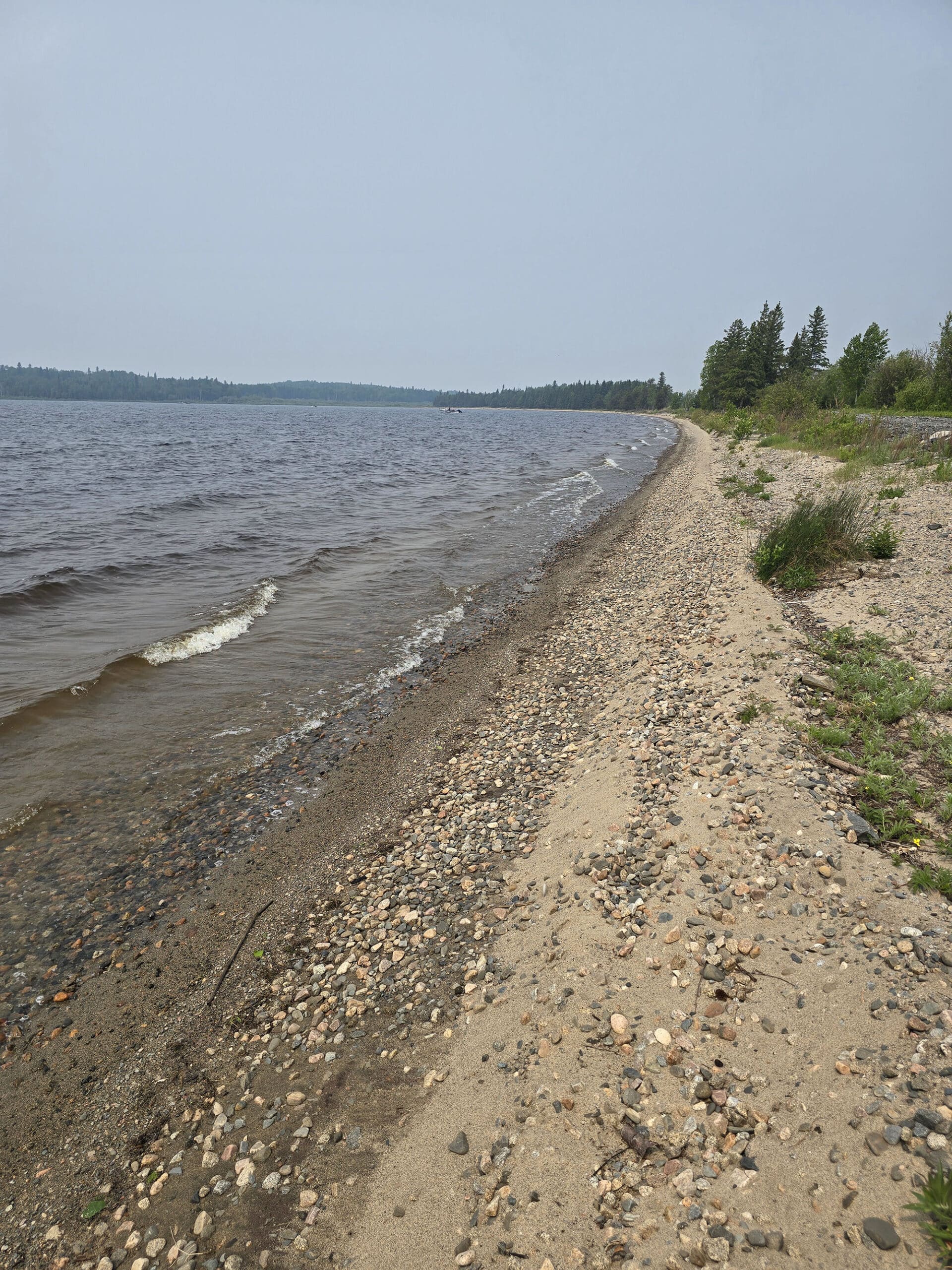 A view up a narrow, rocky beach at Pakwash Provincial Park.
