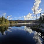 A boardwalk on a still lake on the Trappers Trail in Lake Superior Provincial Park.