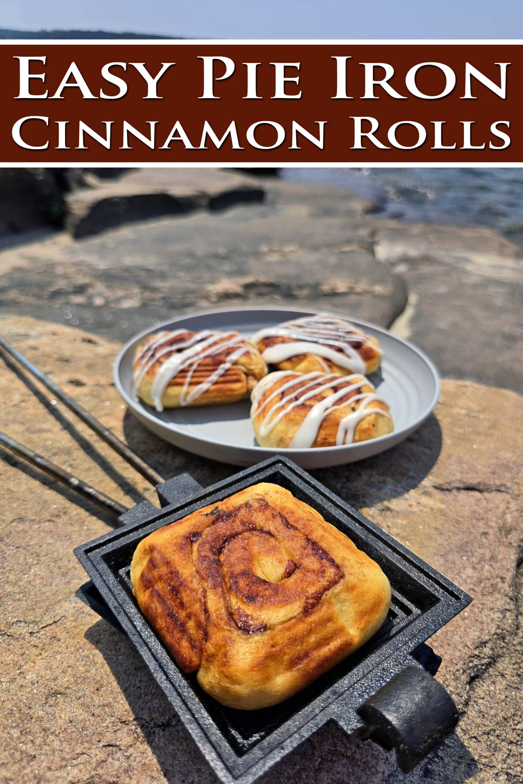 A plate of frosted pie iron cinnamon rolls and an unfrosted cinnamon roll in a pie iron.