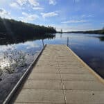 A view over Silent Lake, with a boat dock in the foreground.