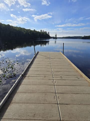 A view over Silent Lake, with a boat dock in the foreground.