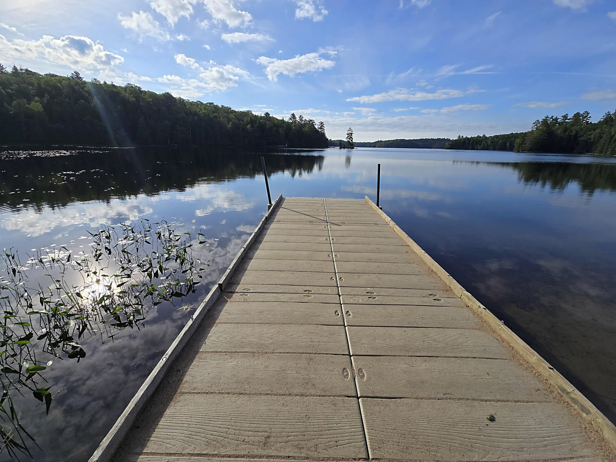 A view over Silent Lake, with a boat dock in the foreground.
