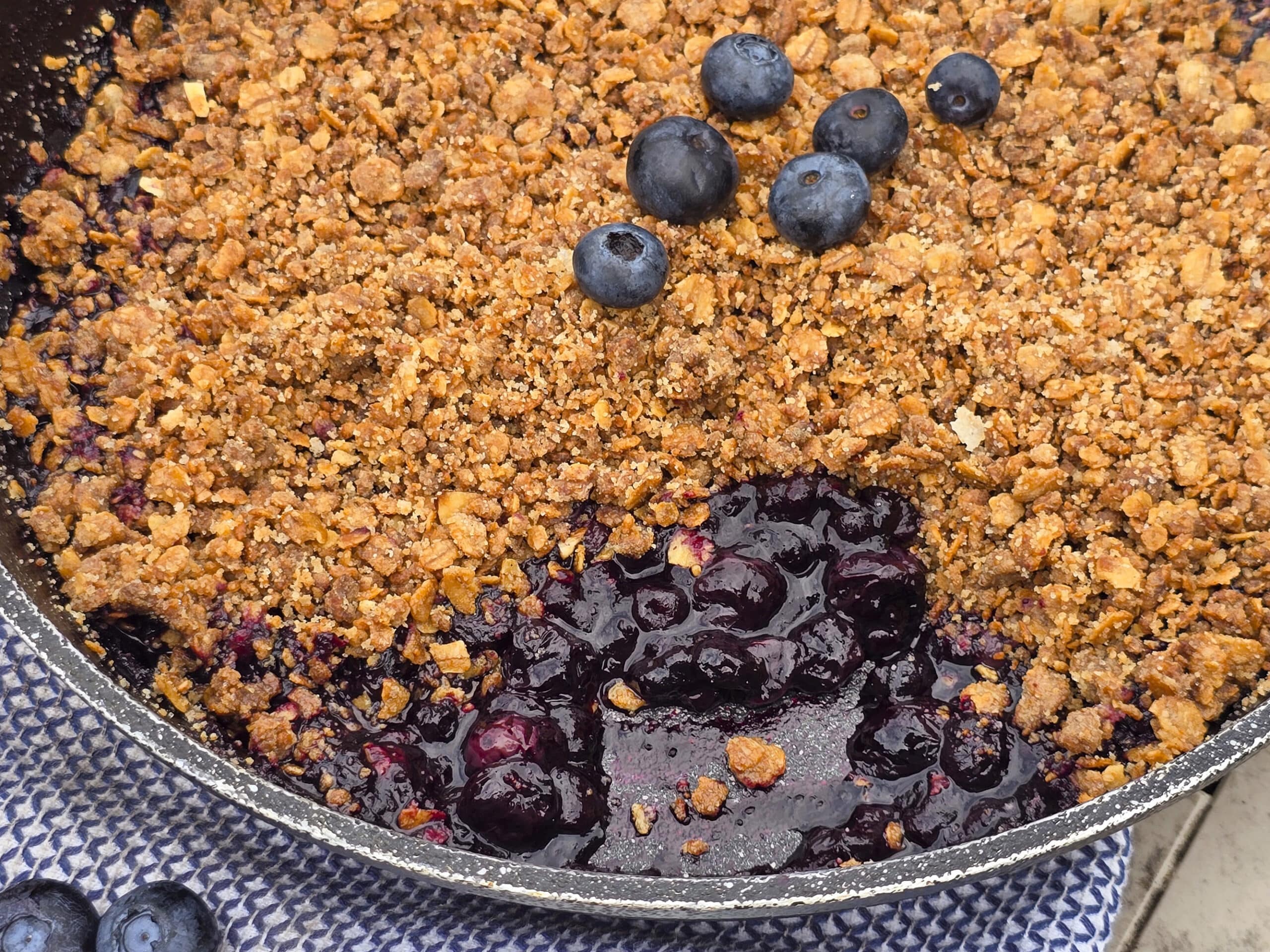 A pan of skillet blueberry crisp.