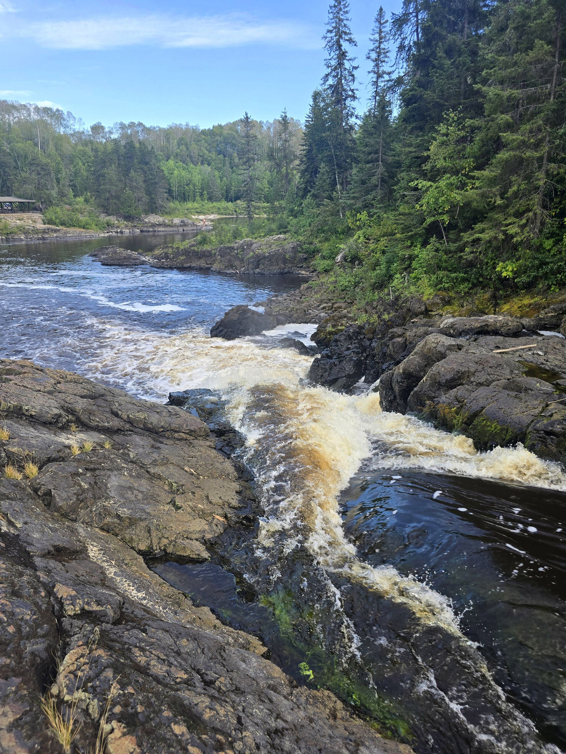 The view over the top of a waterfall at Kap-Kig-Iwan Provincial Park.