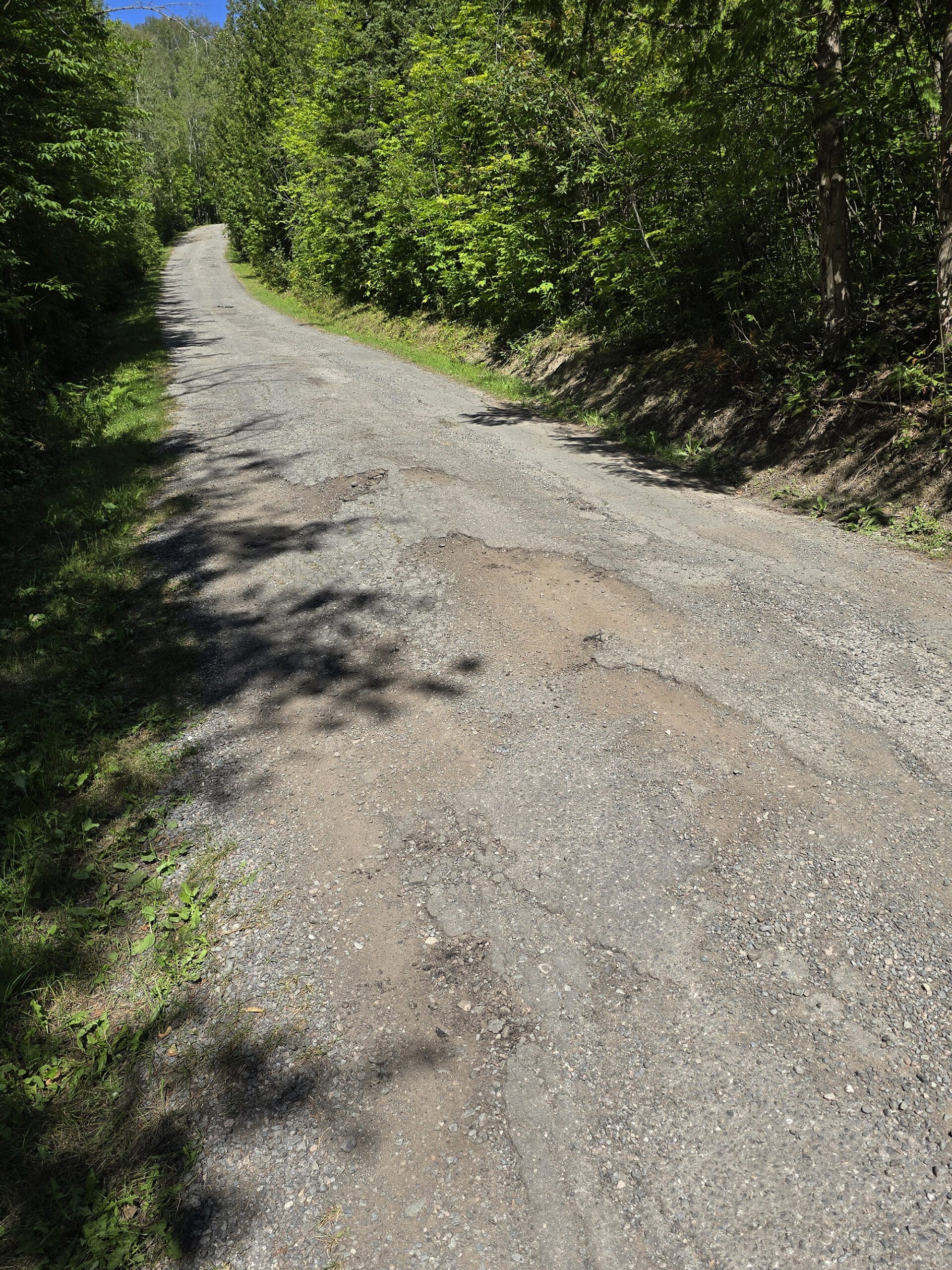 A rough, uphill, water damaged road at Kap-Kig-Iwan Provincial Park.