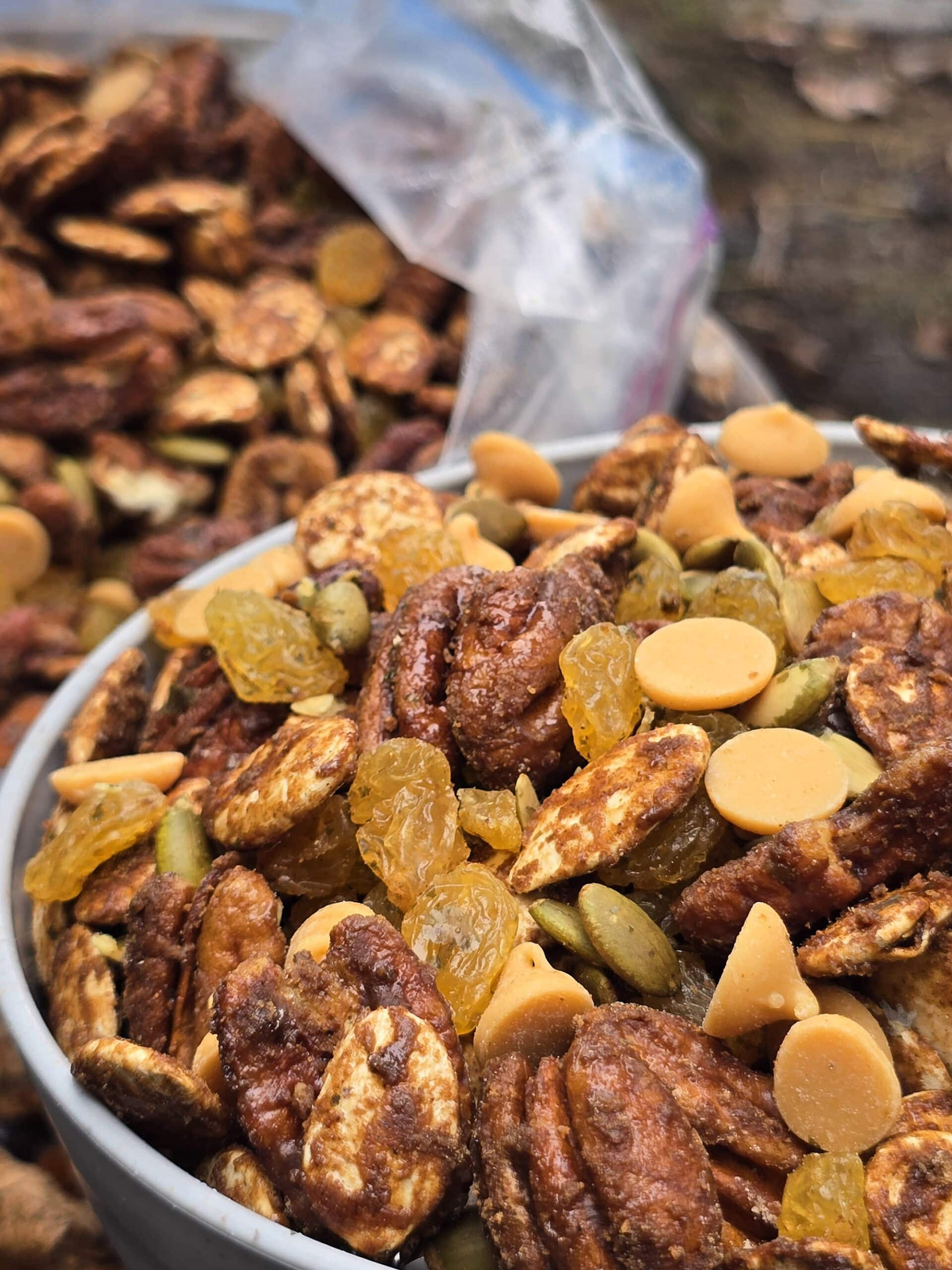 A bowl and a bag of homemade pumpkin spice trail mix.