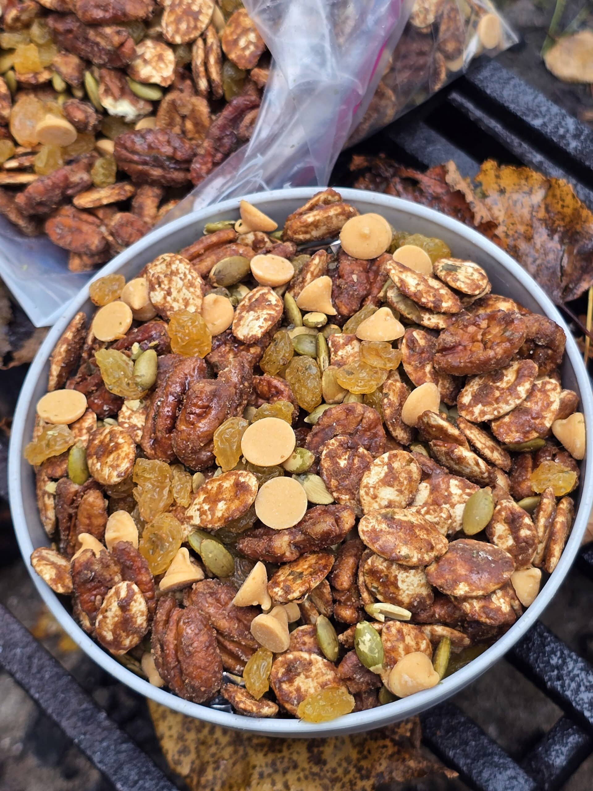 A bowl and a bag of homemade pumpkin spice trail mix.