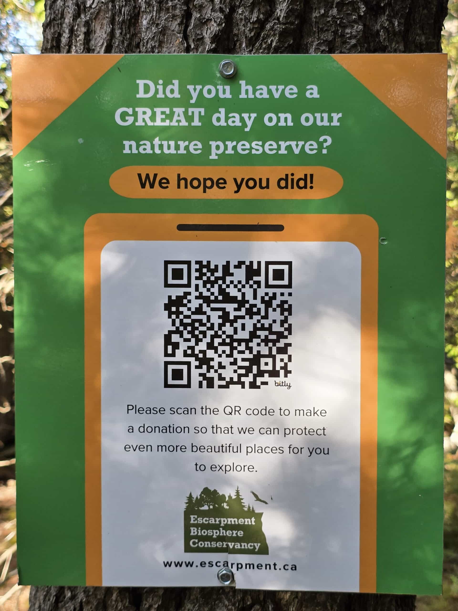 A sign asking for donations to the cup and saucer nature reserve.