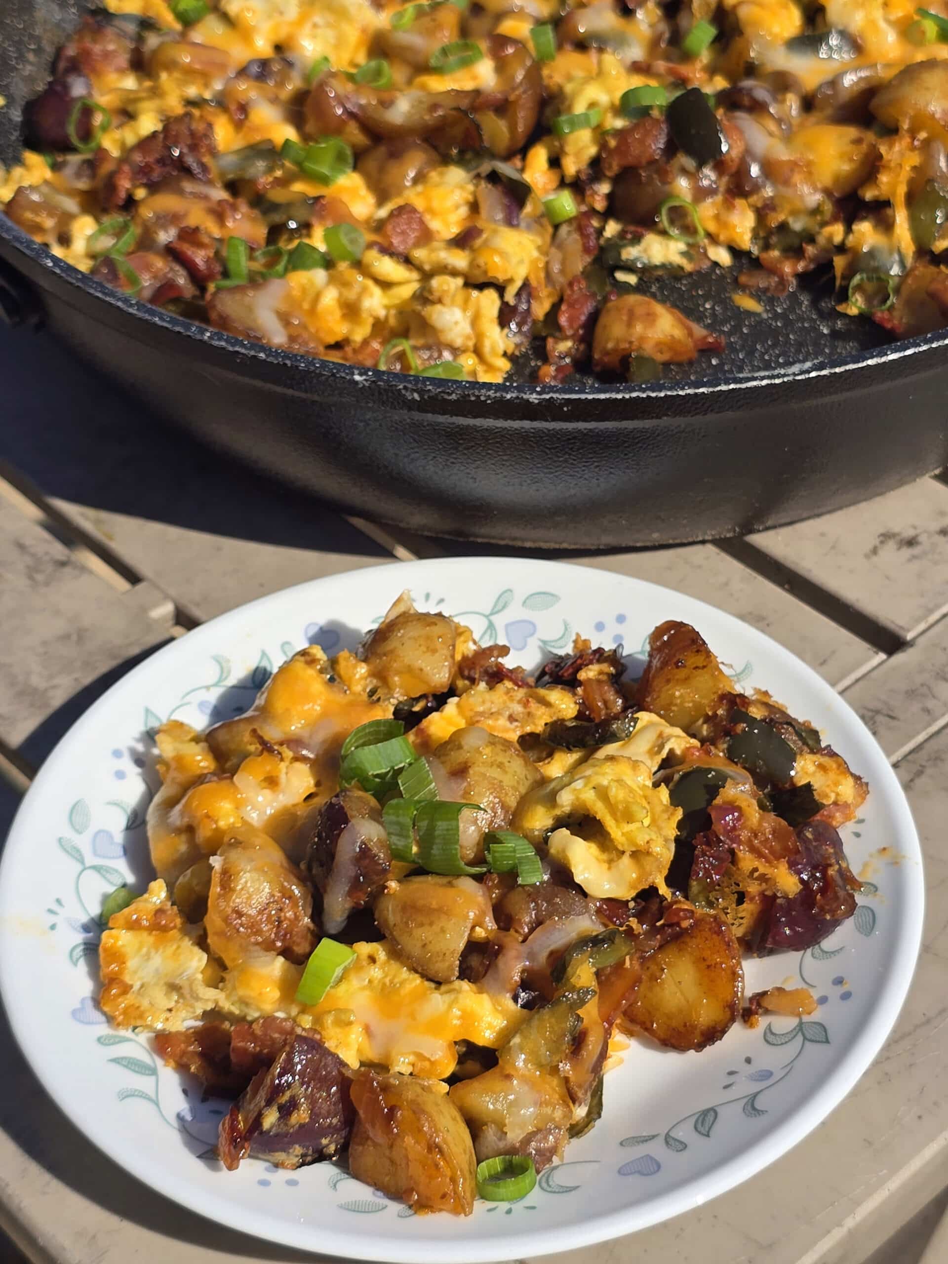A pan and plate of smoky garlic chipotle breakfast skillet.