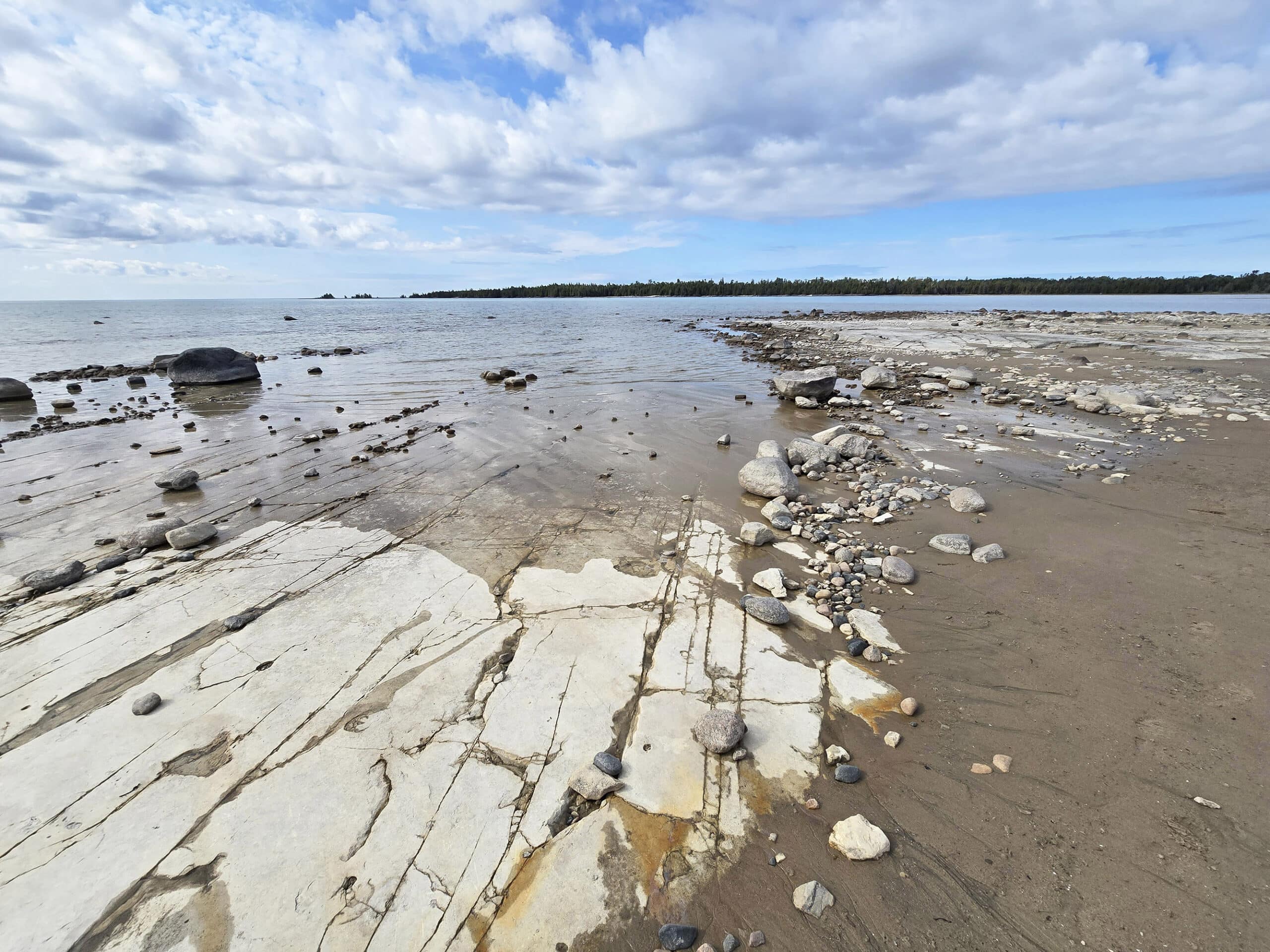 A coastal alvar rock beach extending onto misery bay.