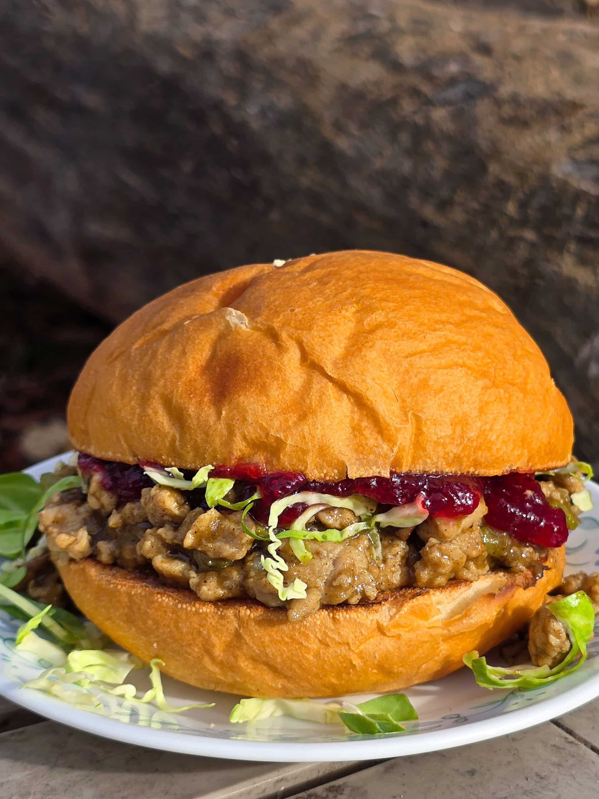 A Thanksgiving Turkey Sloppy Joes Sandwich with ground turkey, veggies, gravy, cranberry sauce, and shredded Brussels Sprouts.