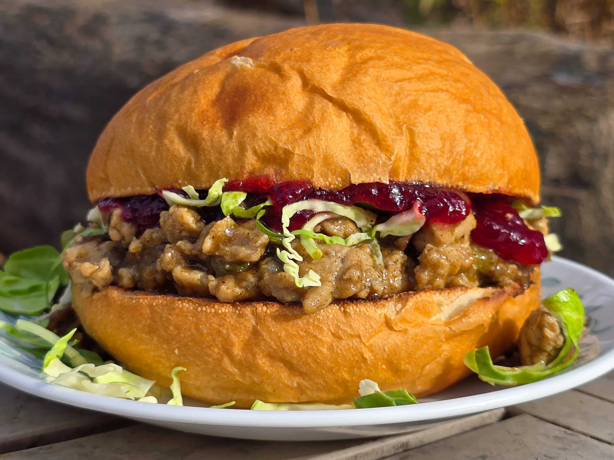 A Thanksgiving Turkey Sloppy Joes Sandwich with ground turkey, veggies, gravy, cranberry sauce, and shredded Brussels Sprouts.