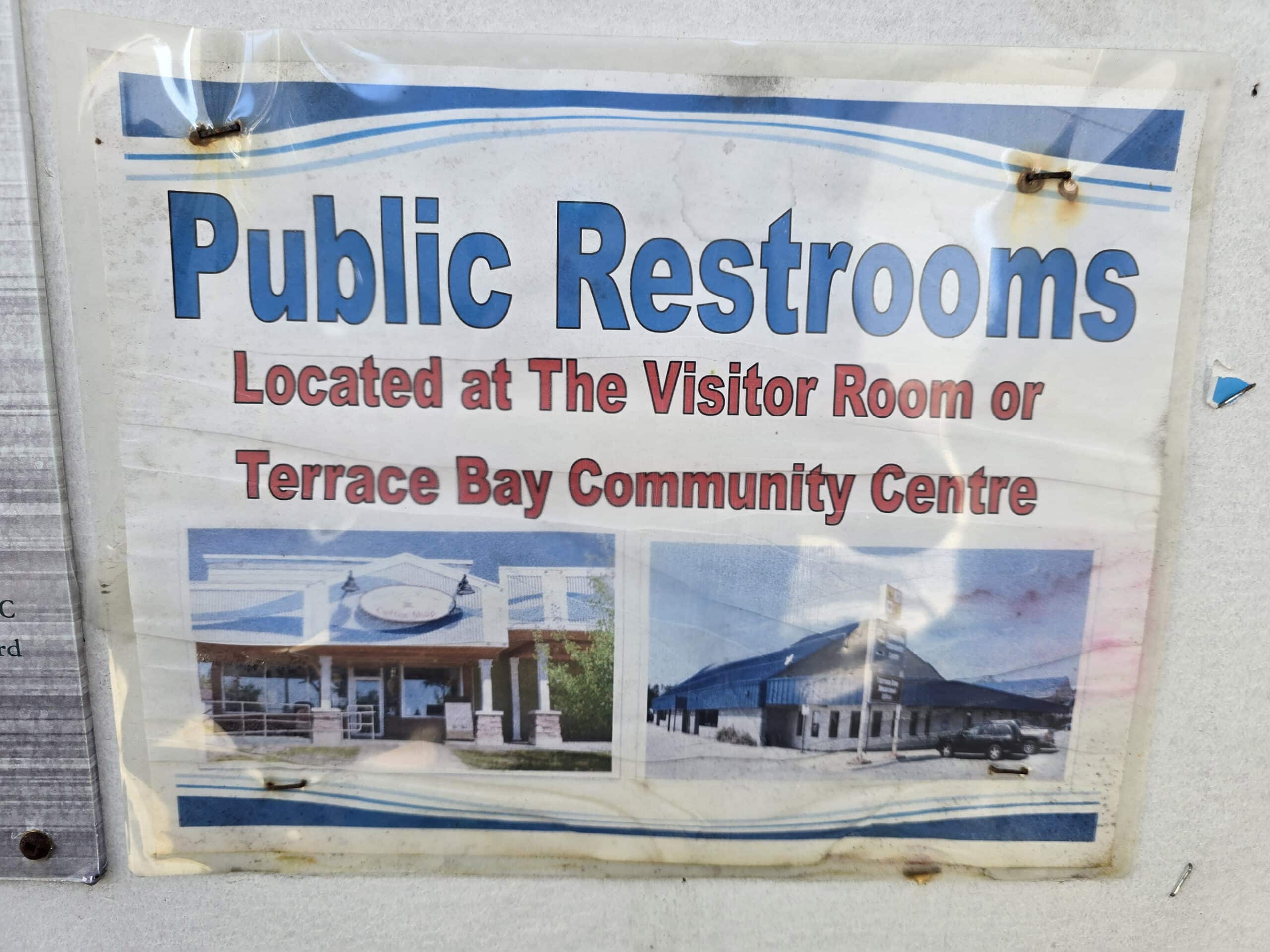 A sign telling visitors that public restrooms are available at the terrace bay community centre.