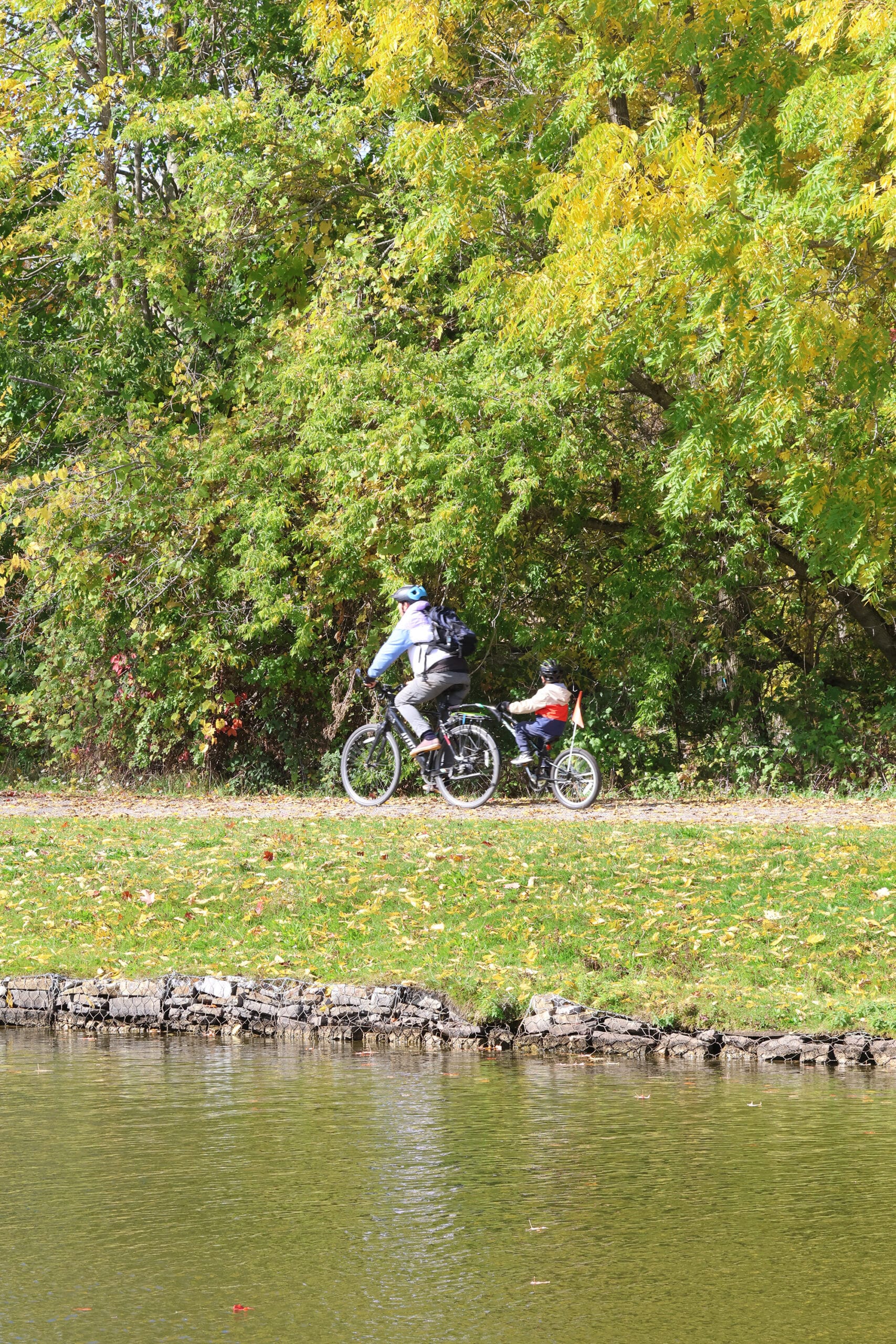 2 people cycling on a trail at peterborough lift lock.