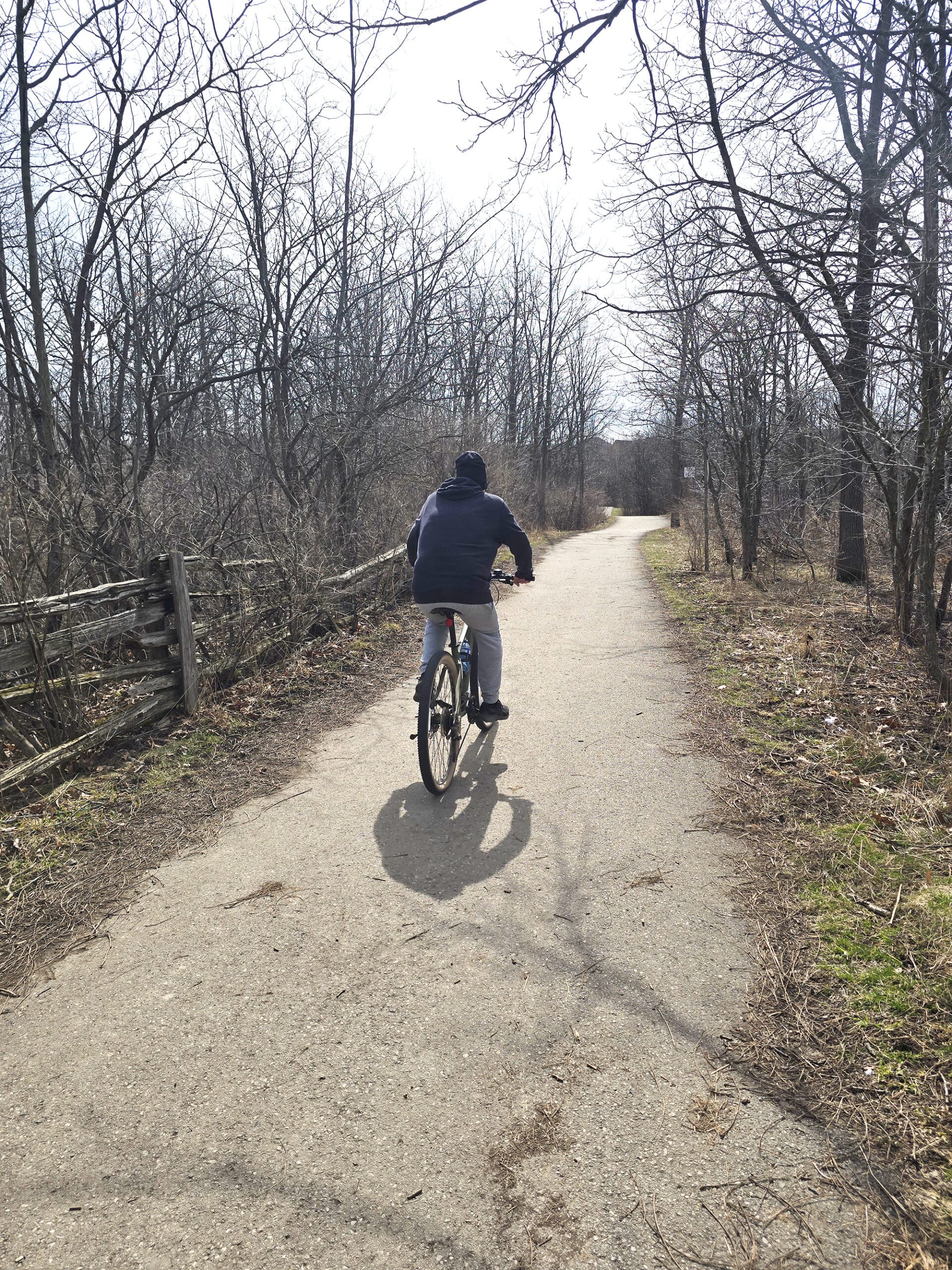 A man riding a bike on a trail at Felker’s Falls Conservation Area.