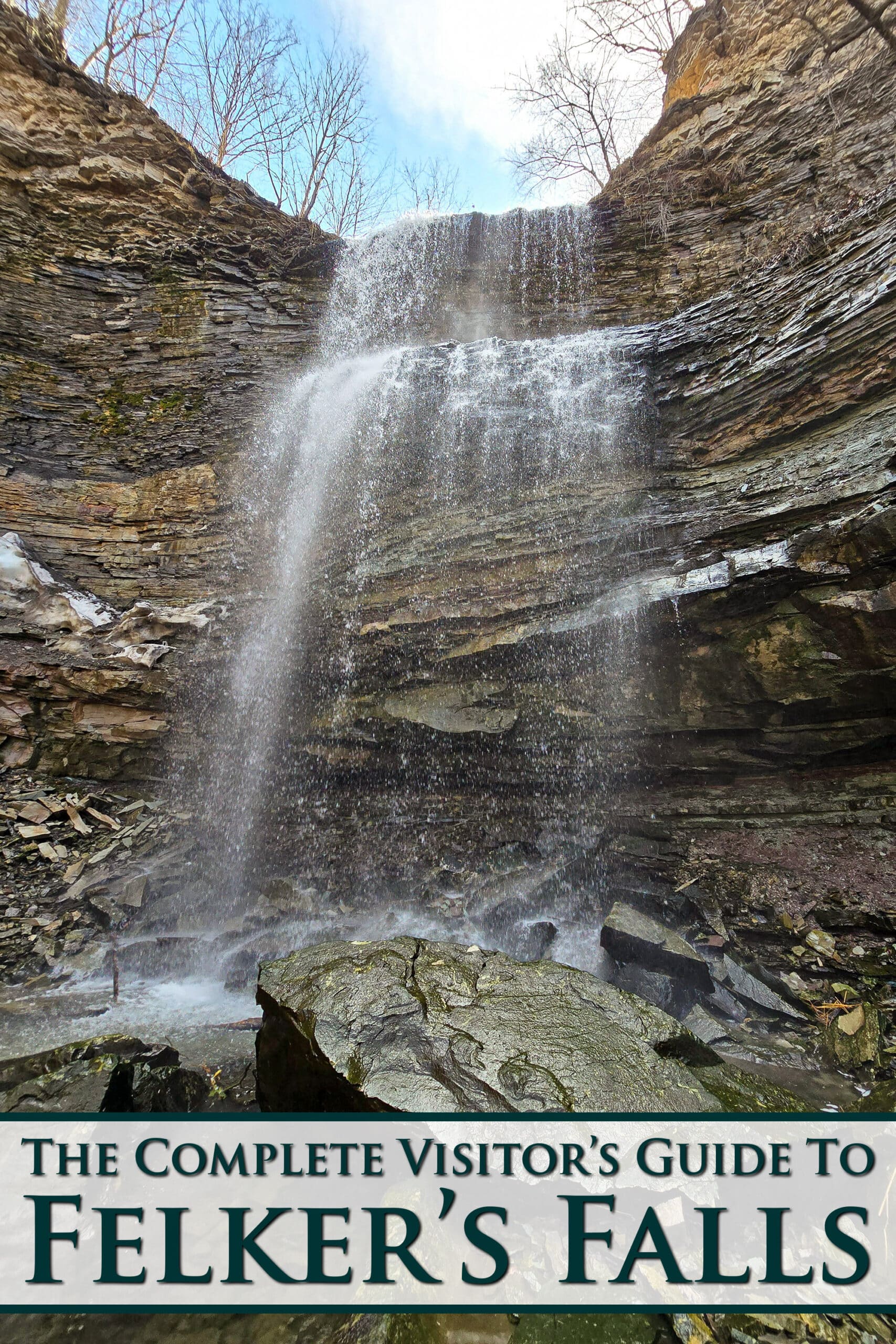 Felker’s Falls waterfall, viewed from the base. Overlaid text says the complete visitor’s guide to Felker’s falls.