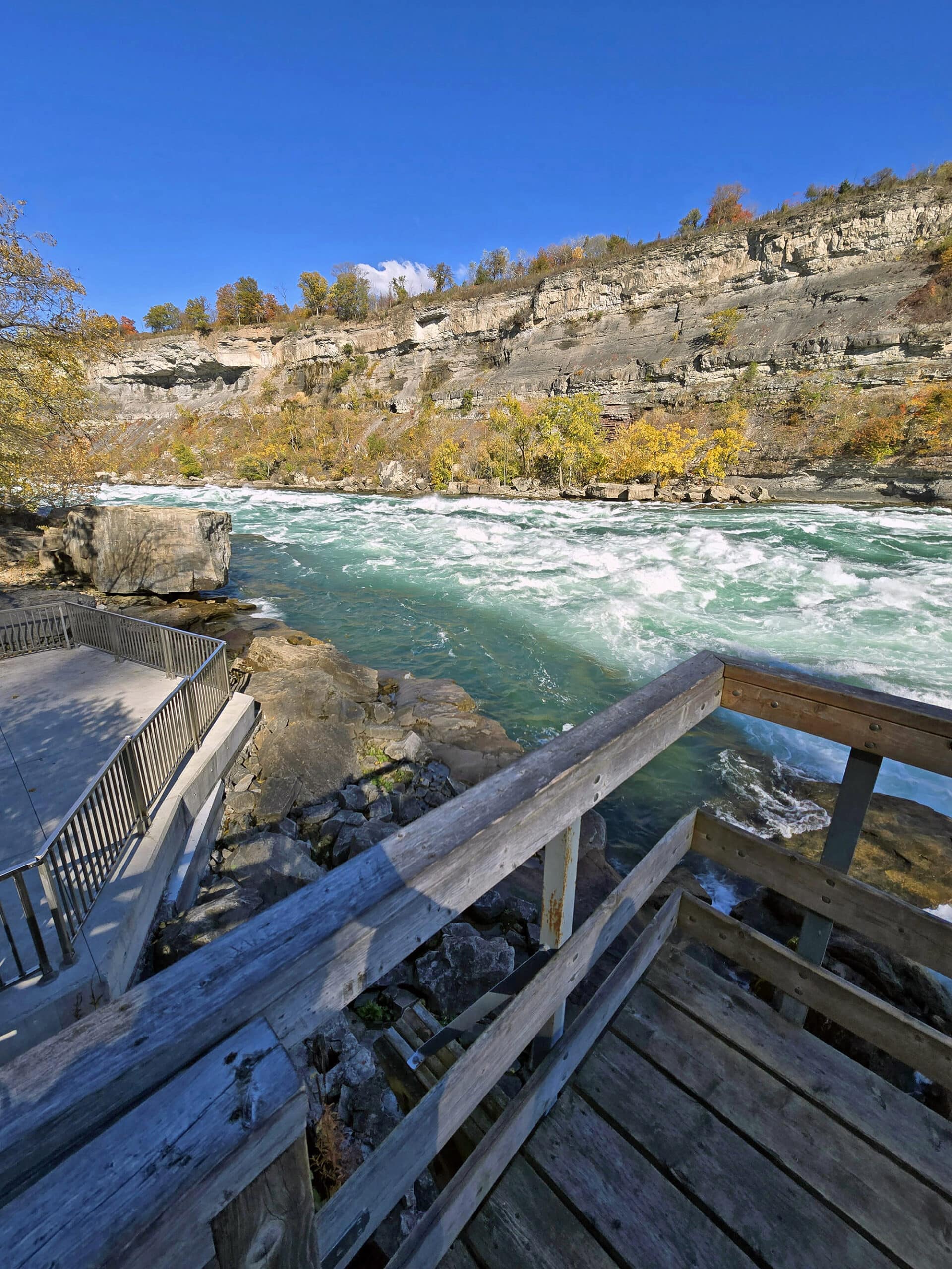 Looking out over white water rapids from the boardwalk at white water walk.