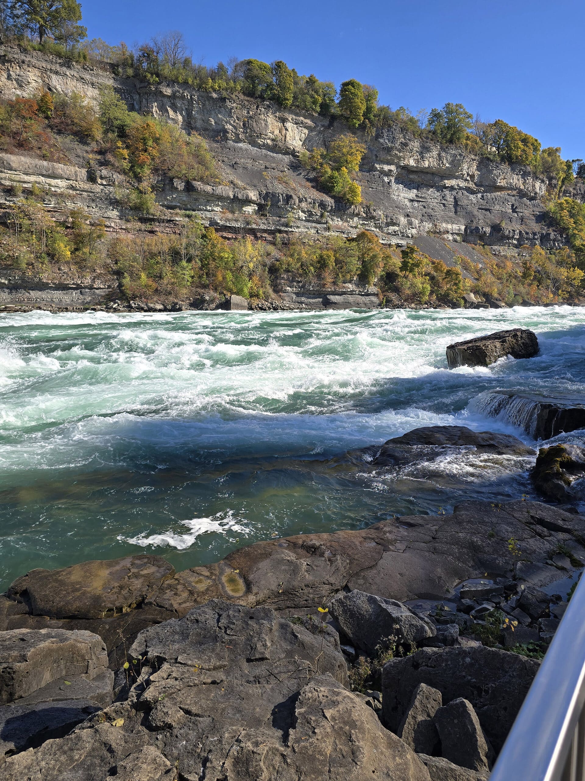 Looking out over white water rapids from the boardwalk at white water walk.
