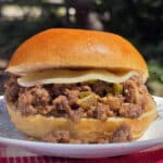 A Philly Cheesesteak Sloppy Joes sandwich with cheese sauce and provolone.