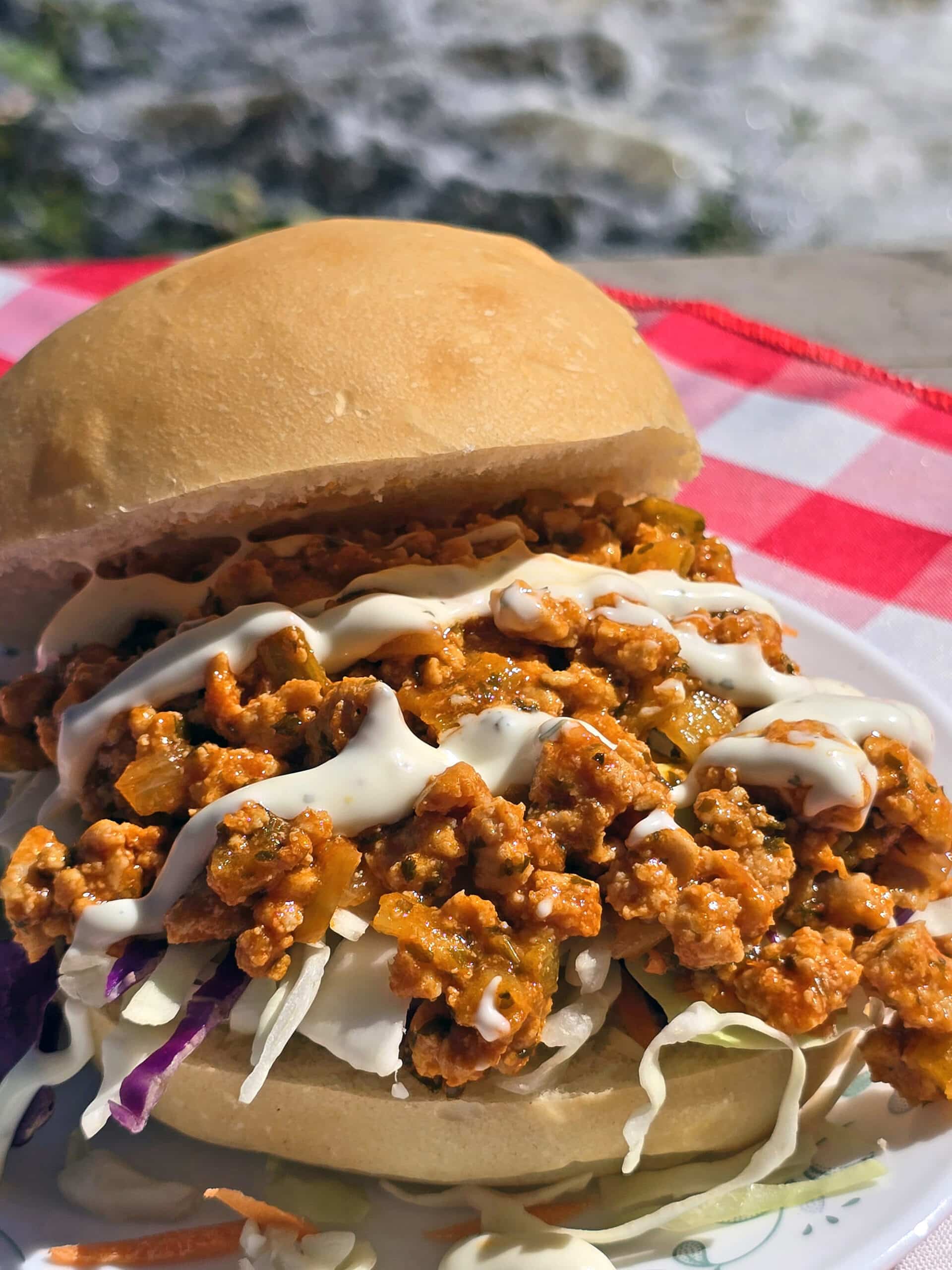 A buffalo chicken sloppy joes sandwich with cabbage and ranch dressing.