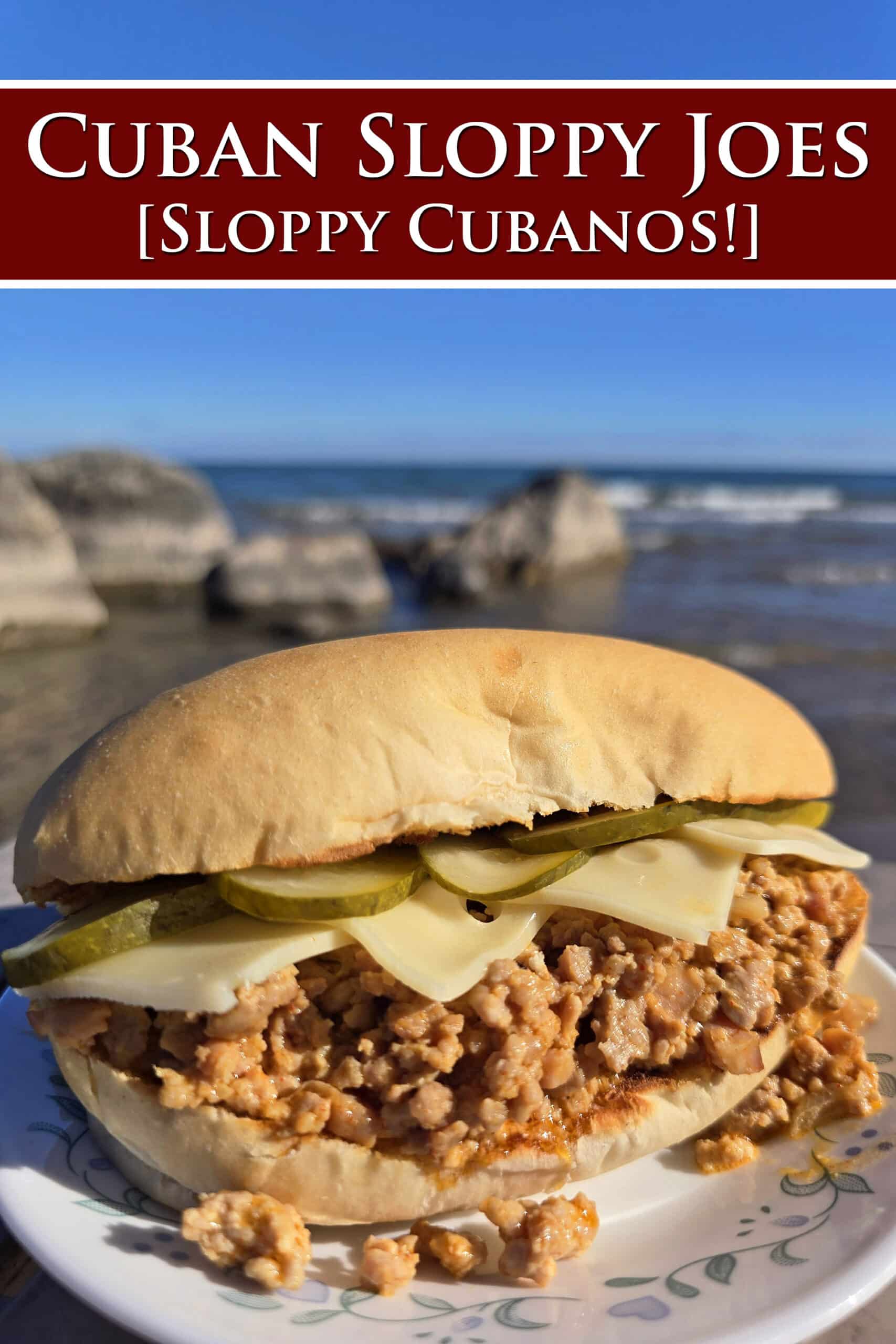 A Cubano Sloppy Joes sandwich with swiss cheese and pickles on top.  Overlaid text says Cuban Sloppy Joes Sloppy Cubanos.