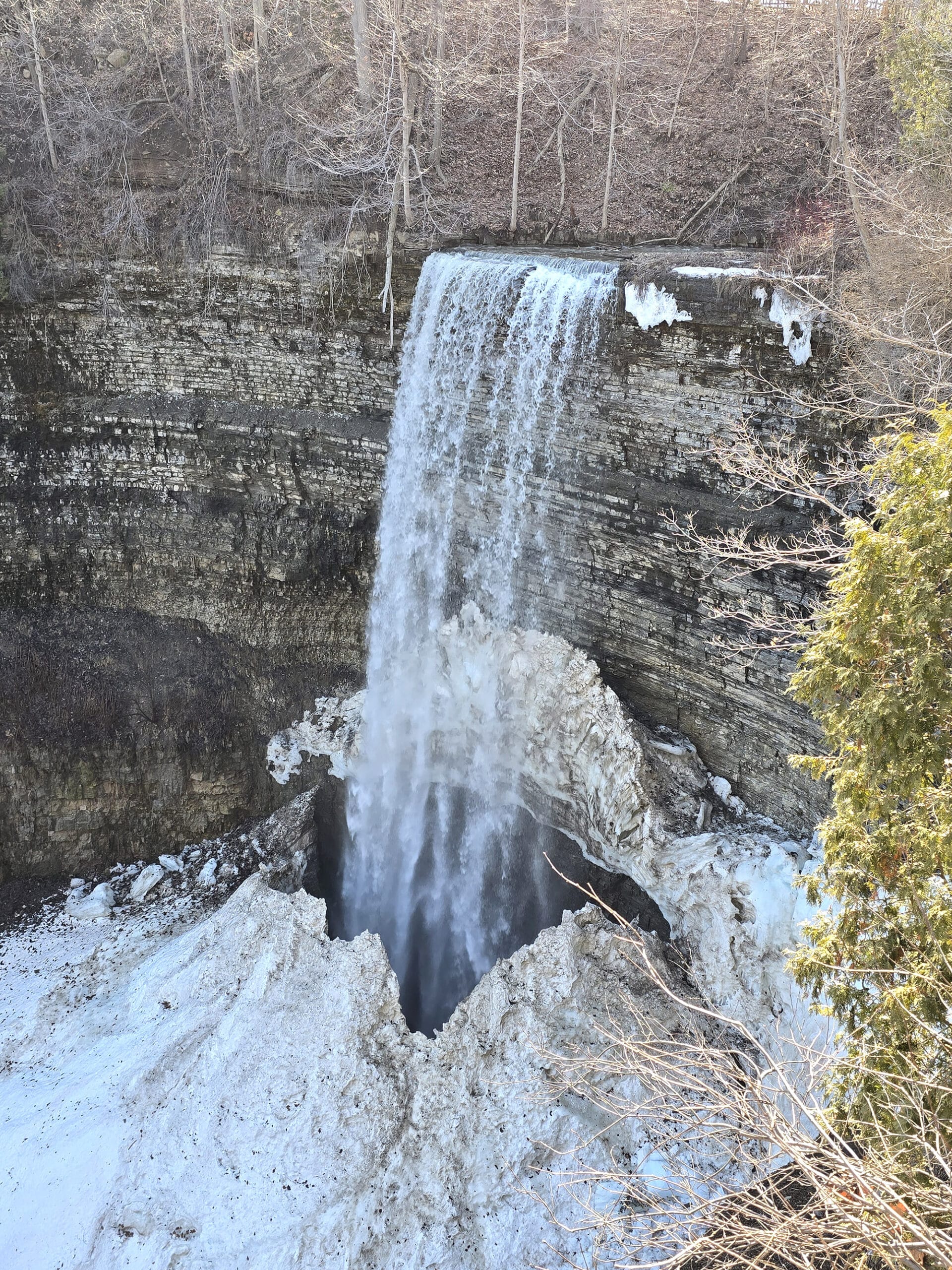 The Tew Falls waterfall, in winter.