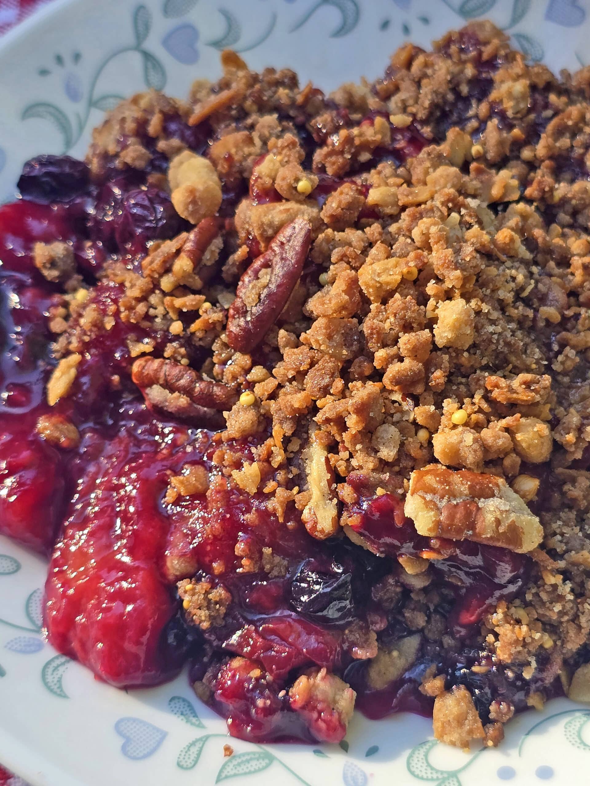A plate of peach blueberry crisp.