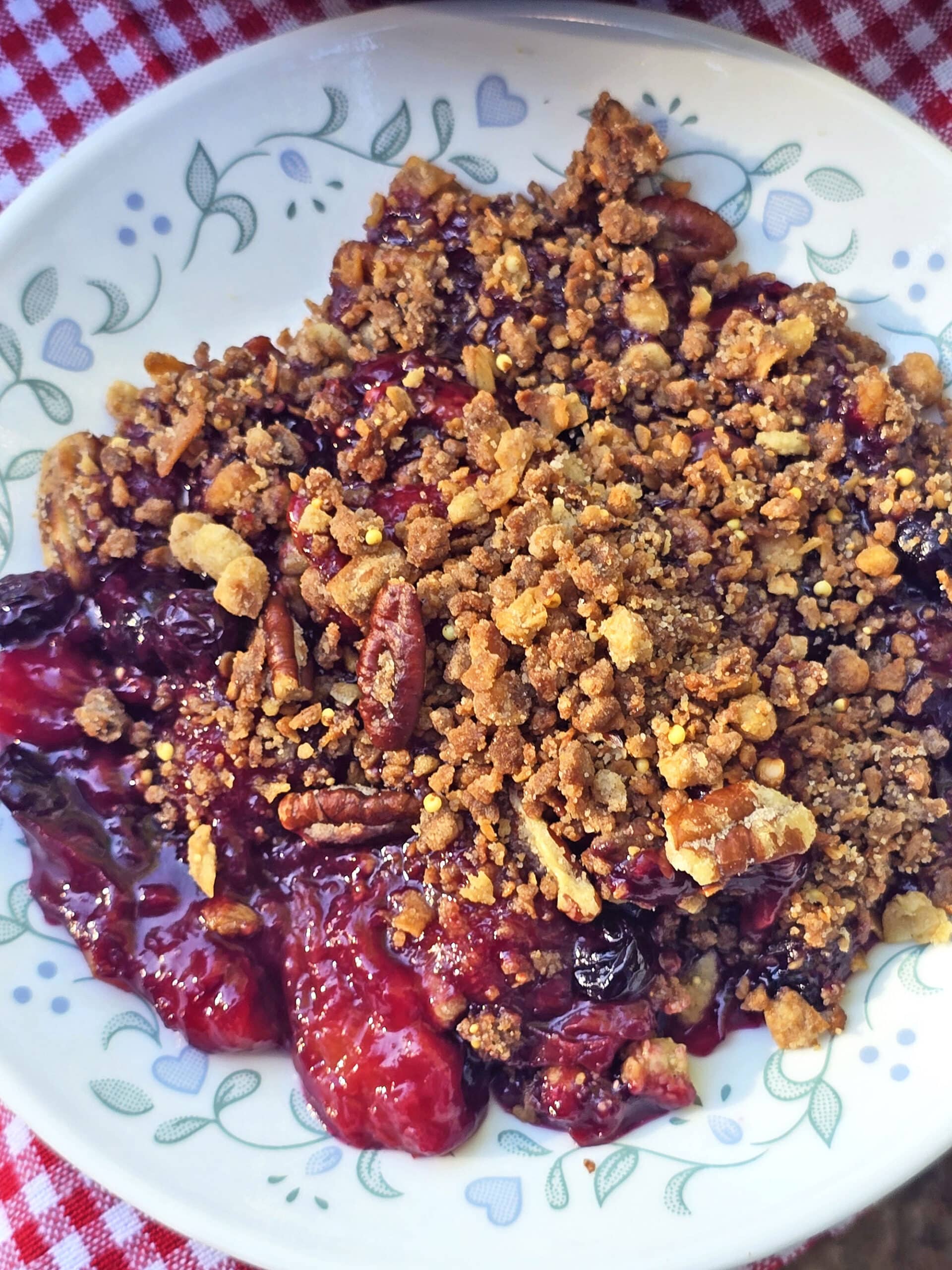 A plate of peach blueberry crisp.