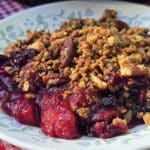 A plate of blueberry peach crisp.