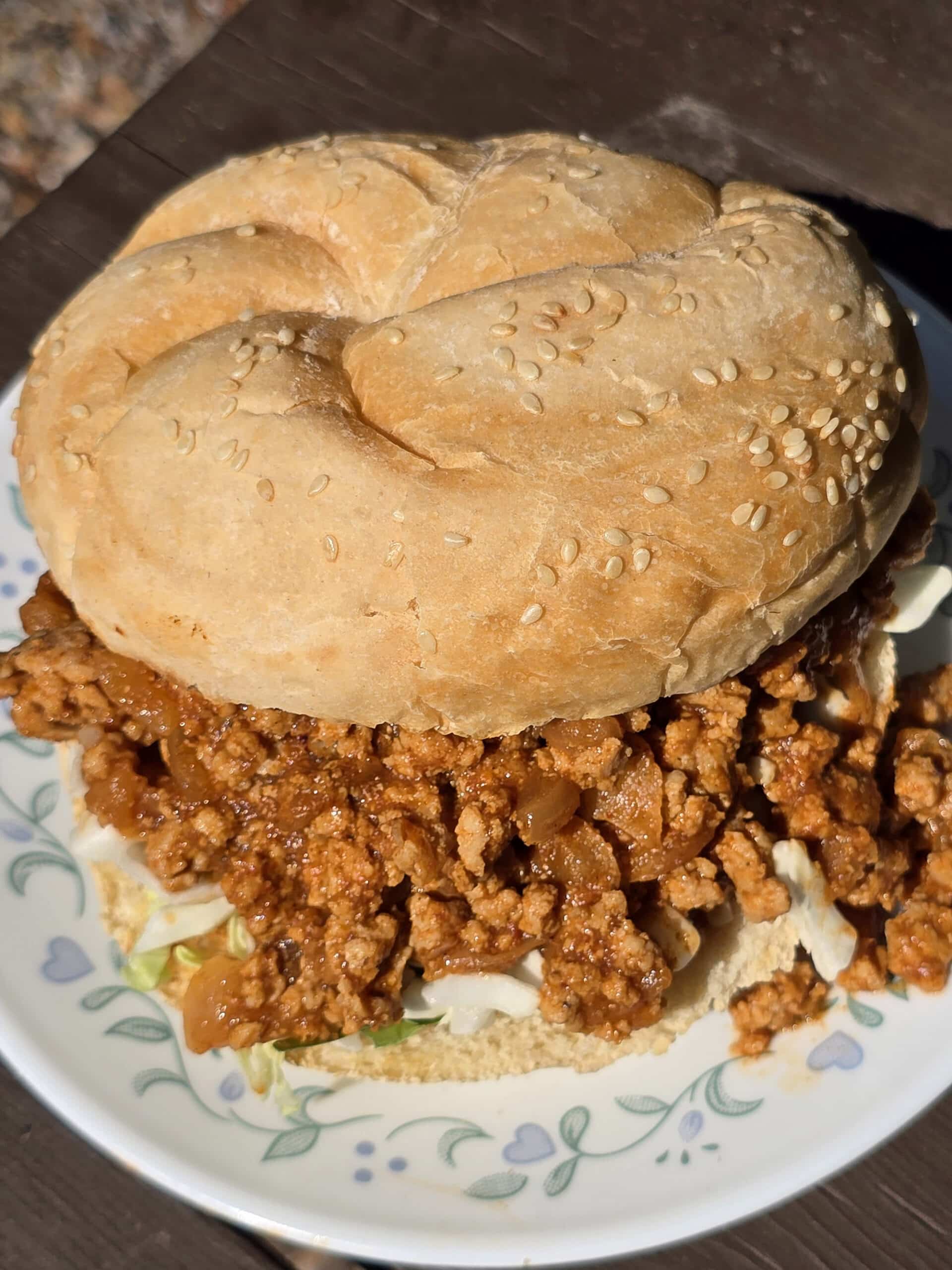 A Berbere Chicken Sloppy Joes sandwich with shredded cabbage.