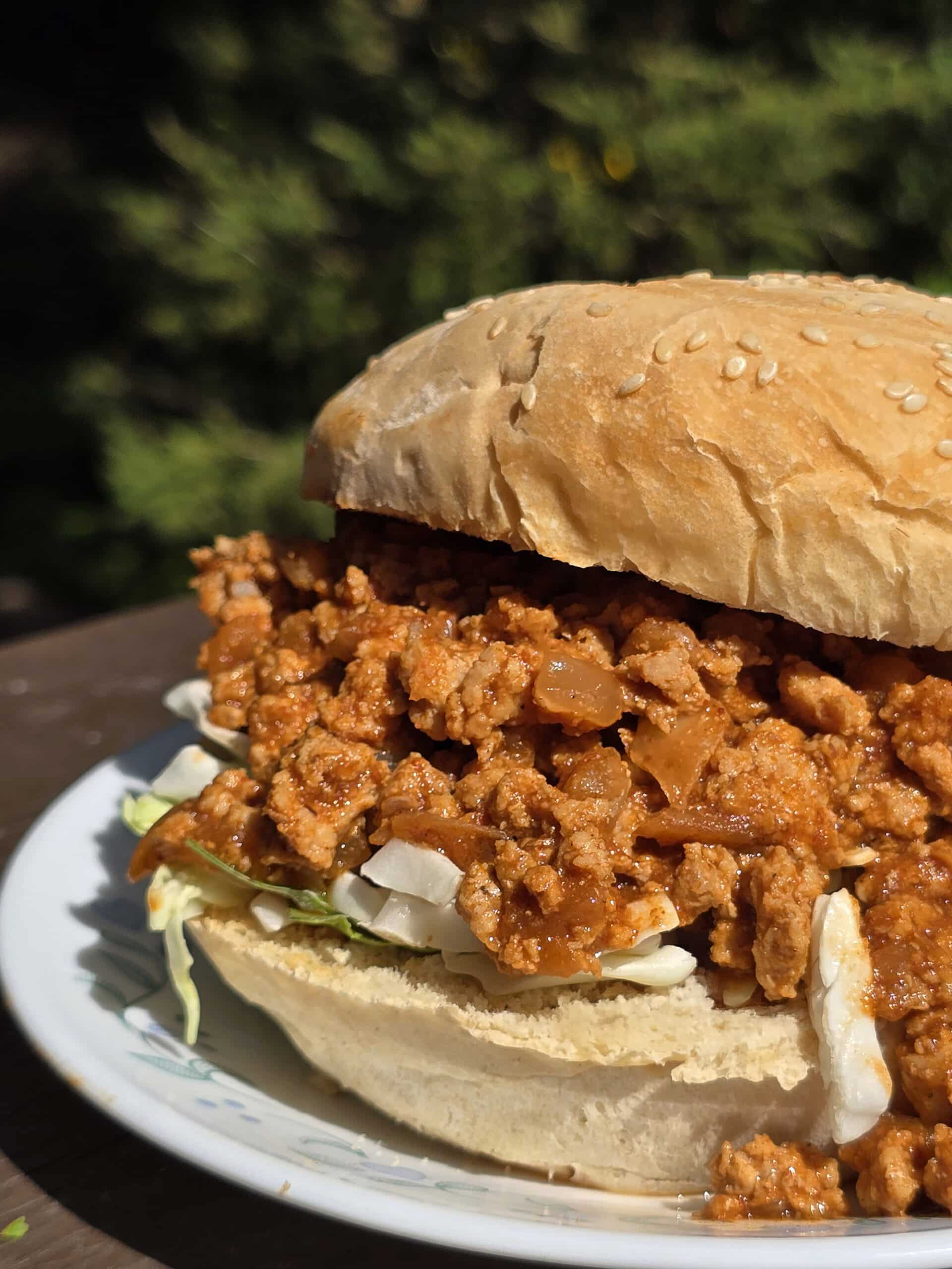 An Ethiopian Sloppy Joes sandwich with berbere spiced ground chicken and shredded cabbage.
