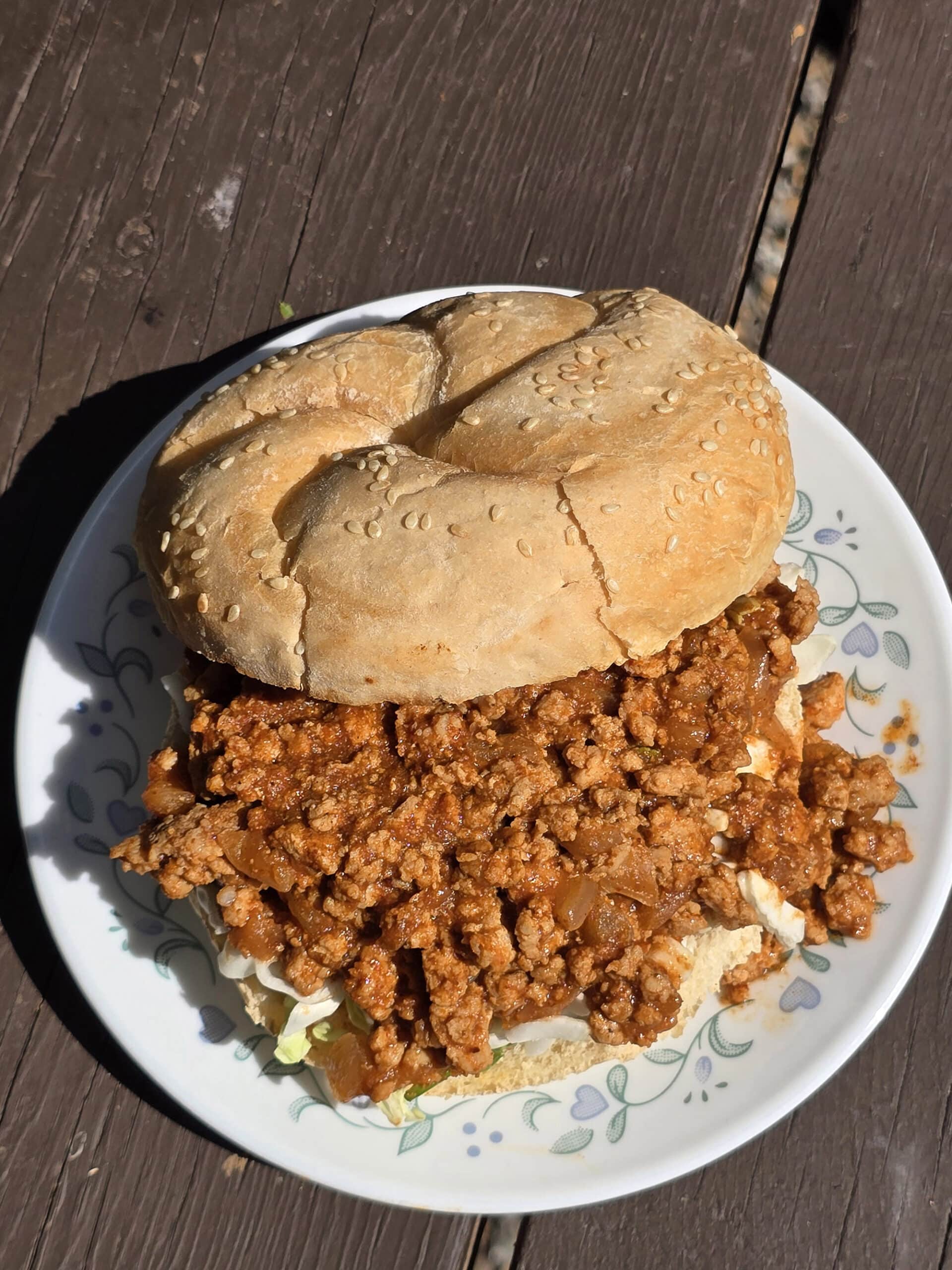 A Berbere Chicken Sloppy Joes sandwich with shredded cabbage.