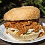 An Ethiopian Sloppy Joes sandwich with berbere spiced ground chicken and shredded cabbage.