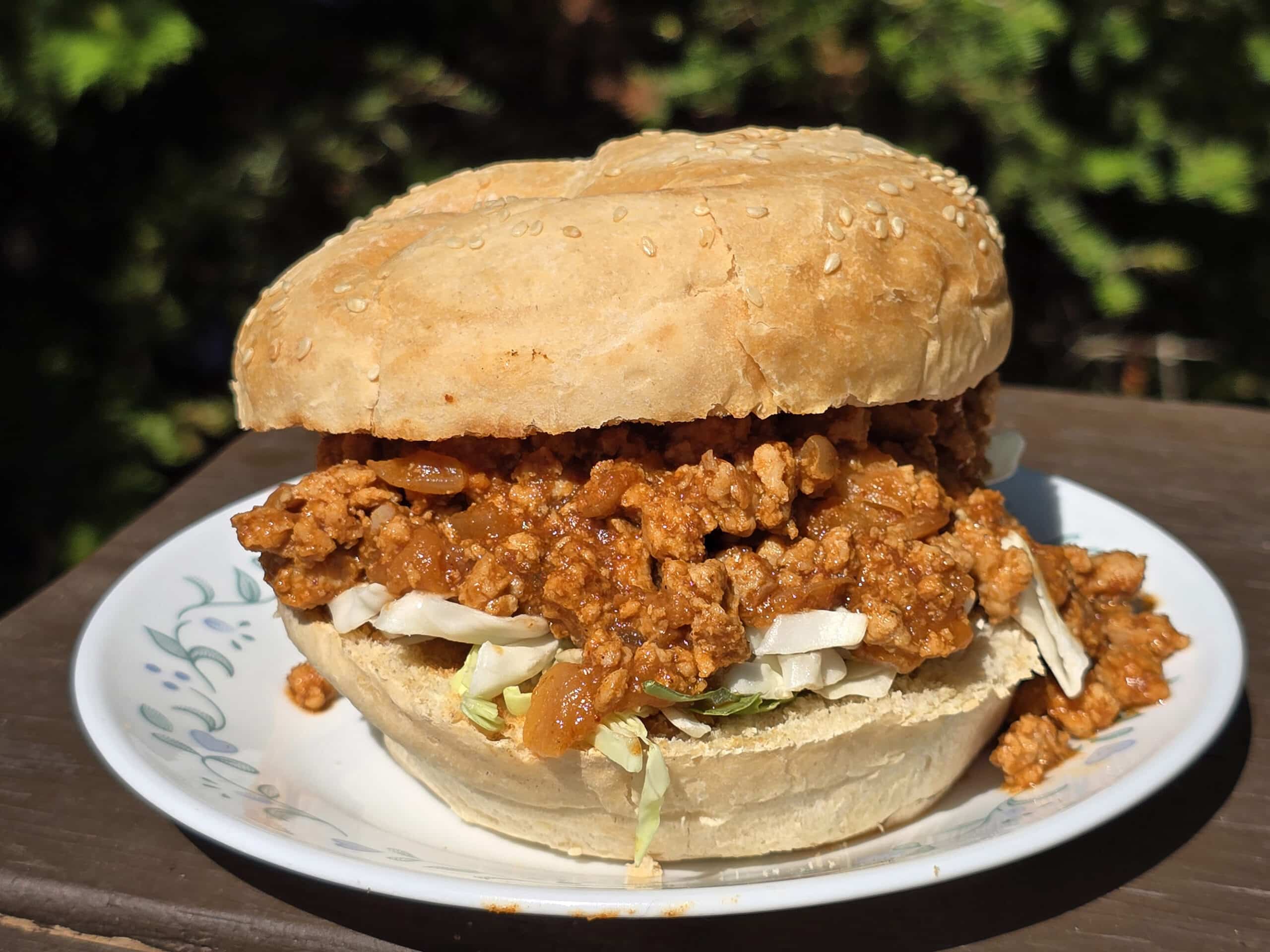 An Ethiopian Sloppy Joes sandwich with berbere spiced ground chicken and shredded cabbage.