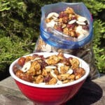A bowl and a bag of Canada day trail mix, with maple glazed nuts, dried cranberries, maple granola, and pumpkin seeds.