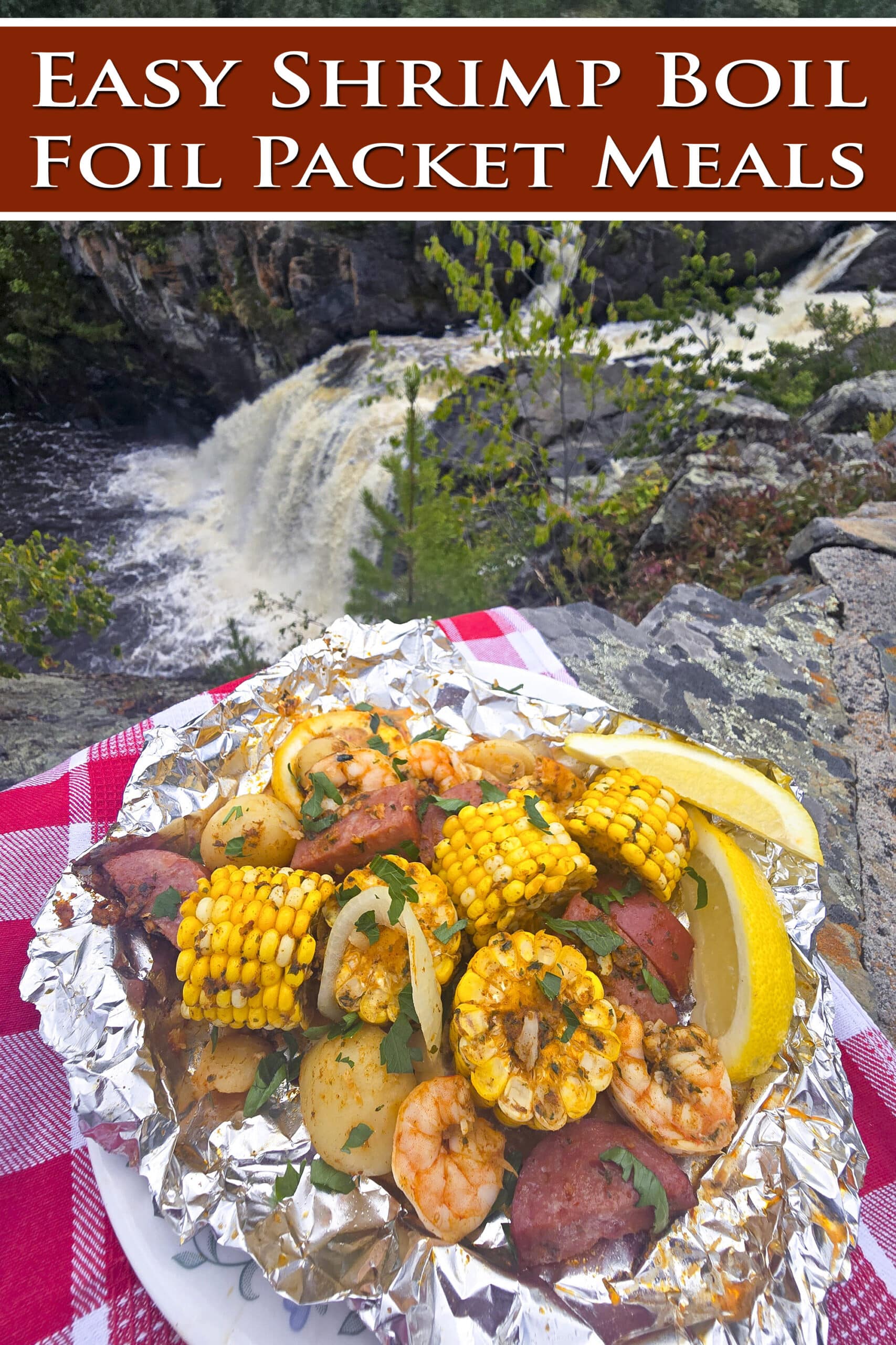 A large serving of seafood boil foil packet meal, on a plate. It has chunks of corn, sausage, potatoes, and shrimp in an obviously heavily seasoned sauce. Overlaid text says easy shrimp boil foil packets.