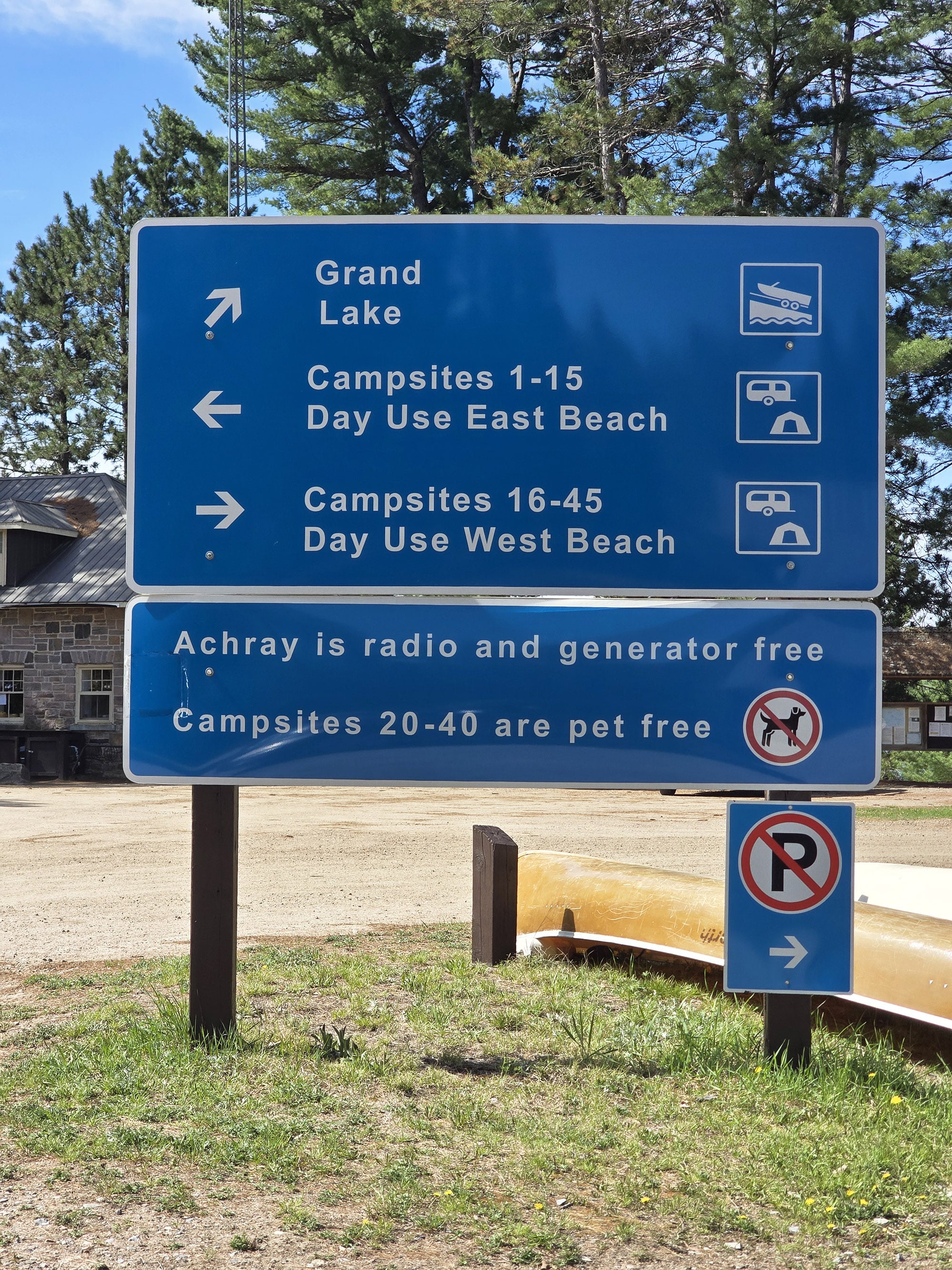 A blue and white directional road sign.