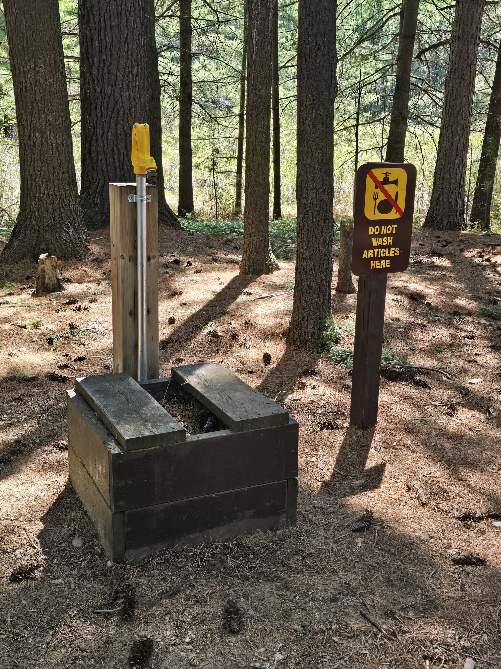 A potable water tap in a campground.