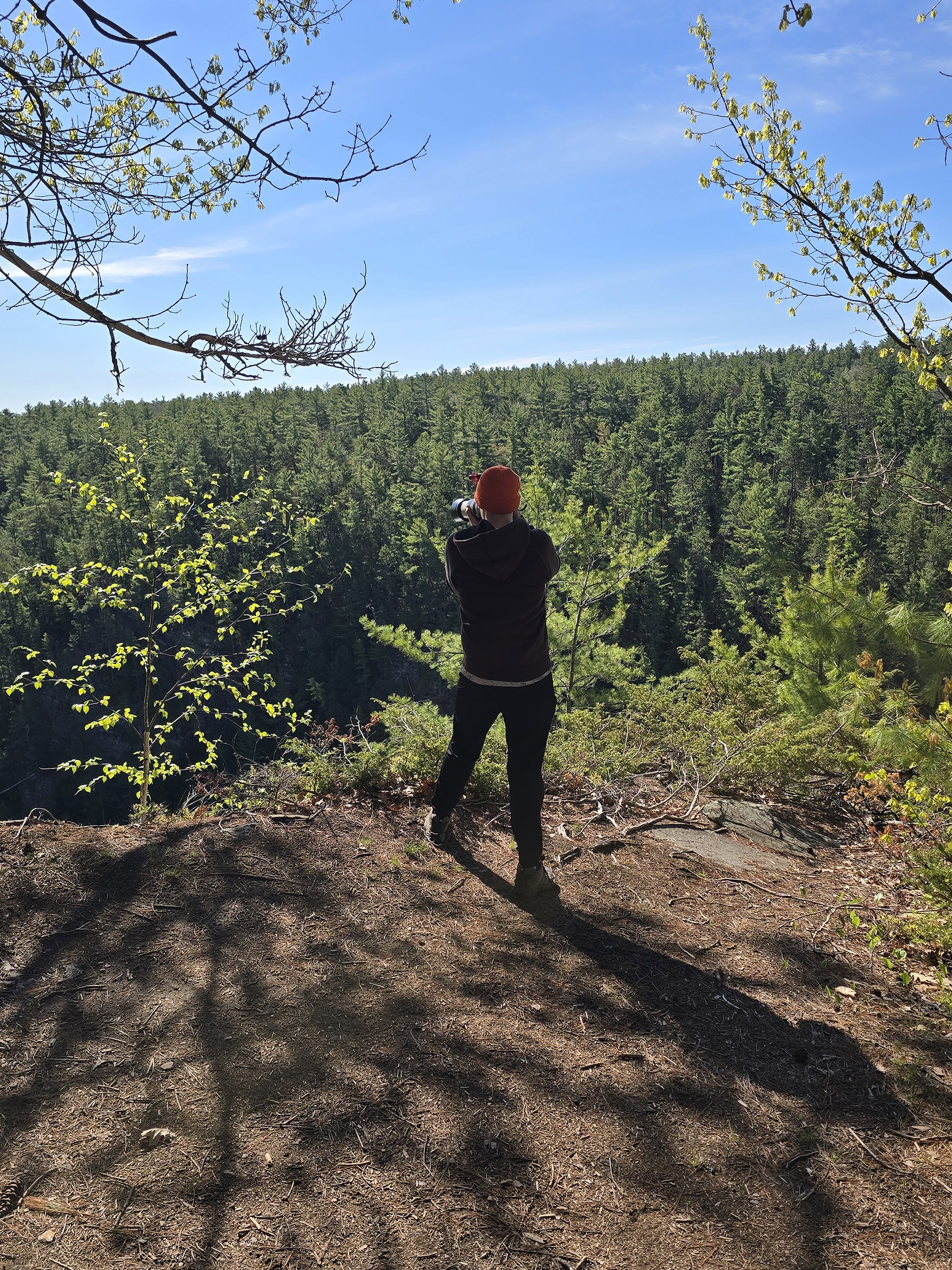 A man photographing the barron canyon from the barron canyon trail.