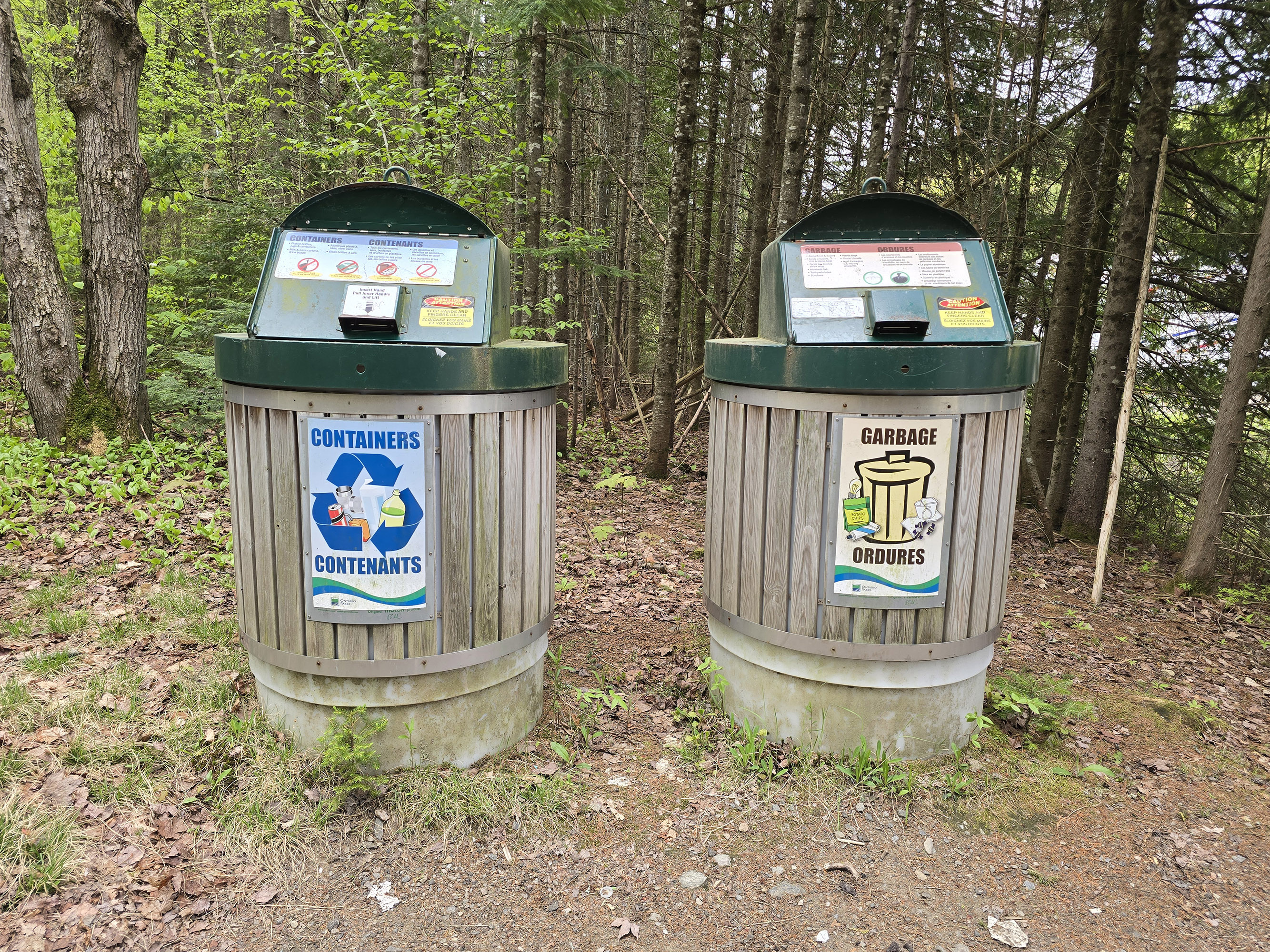 A garbage bin and a recycling bin.