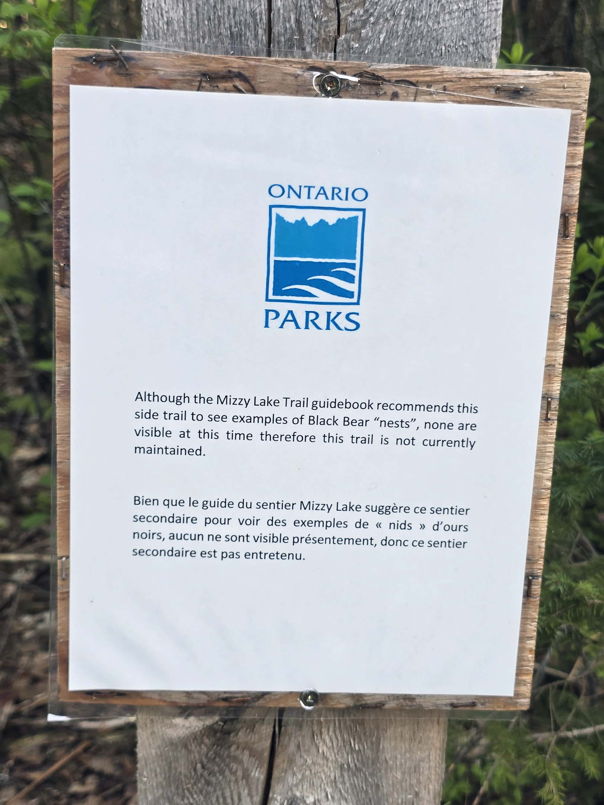 A sign saying that the bear dens are inactive.