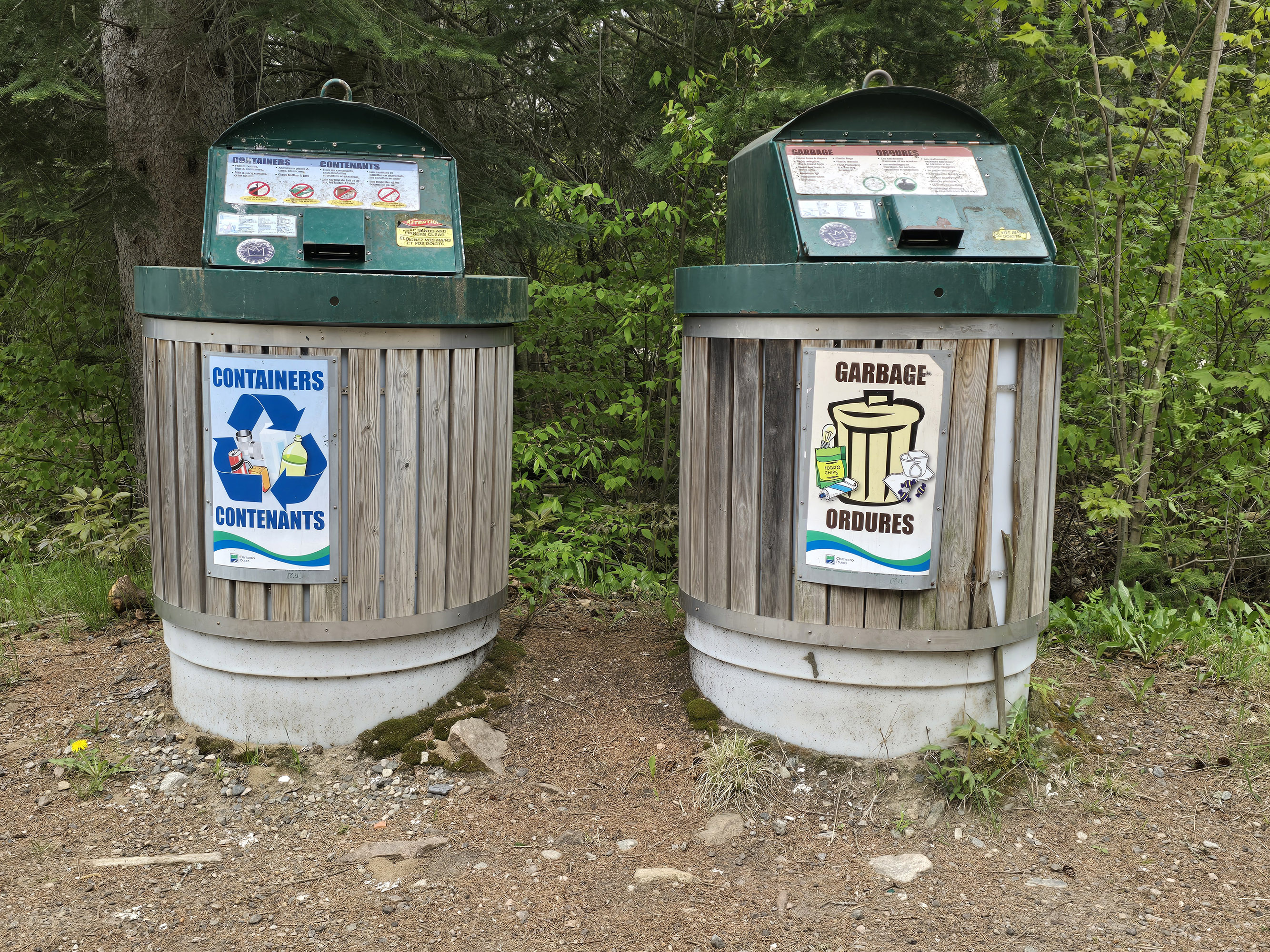 A garbage bin and a recycling bin.