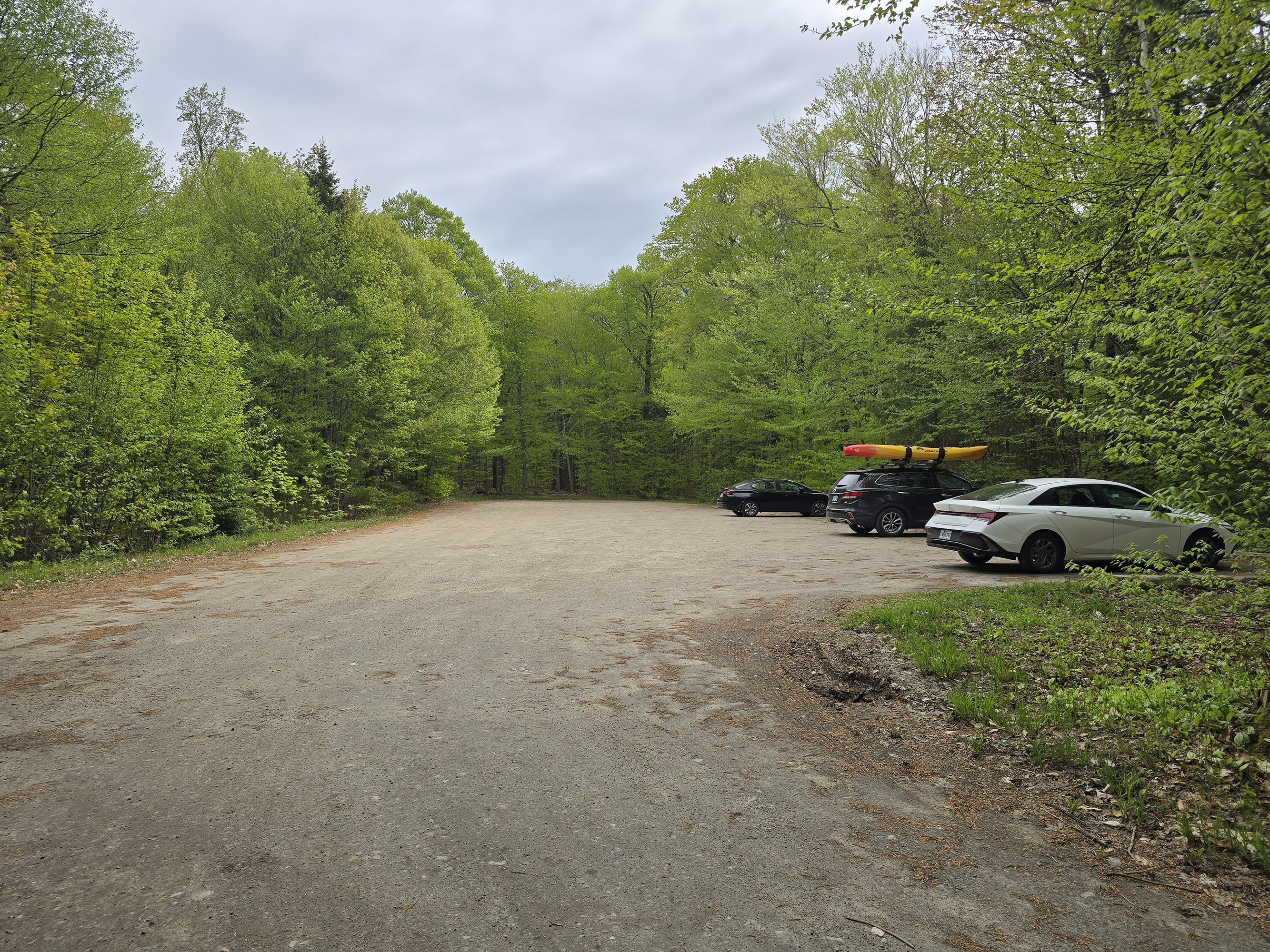 The parking lot for the Peck Lake Trail.