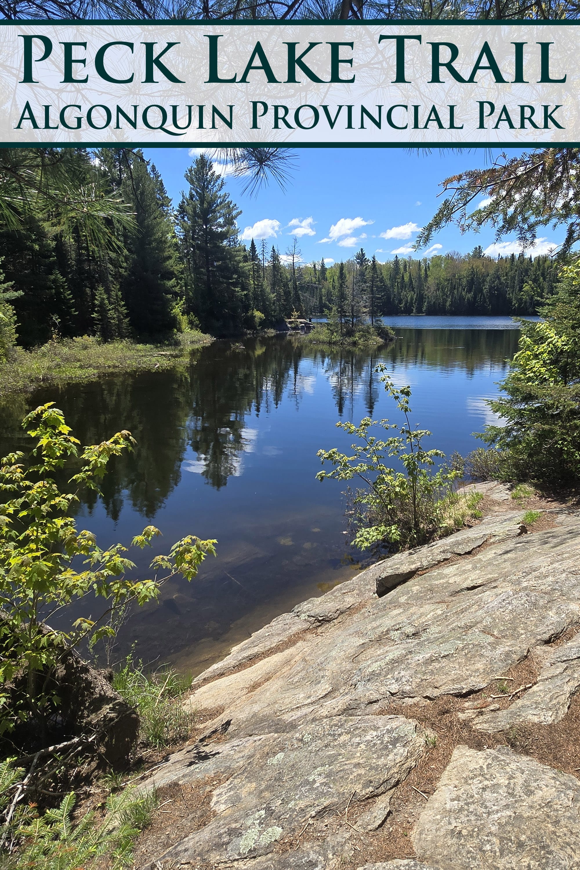 A view over Peck Lake. Overlaid text says peck lake trail algonquin provincial park.