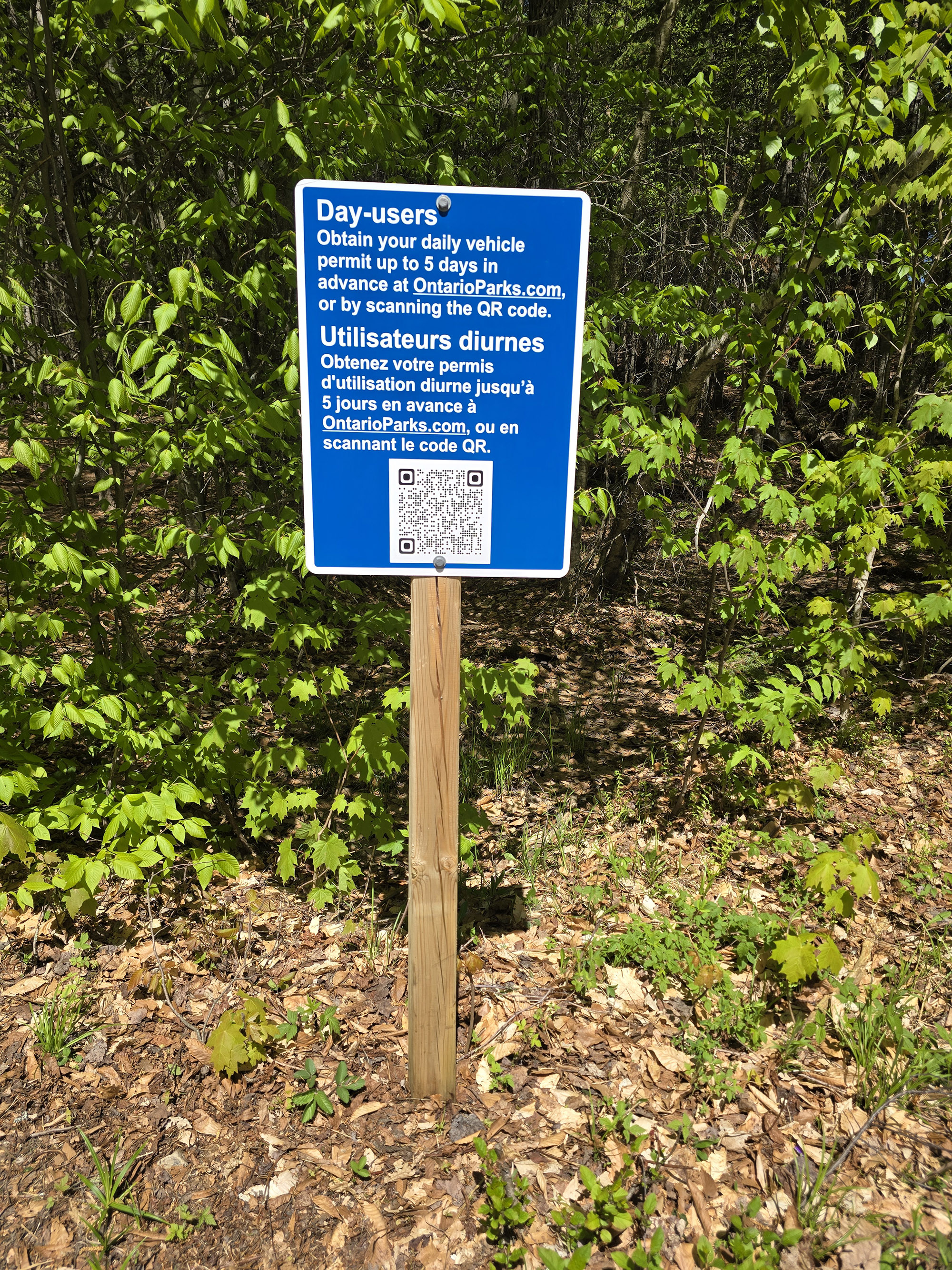 A QR code on a sign for registration.