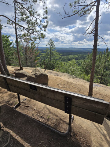 A bench overlooking a cliff, along the Lookout Trail in Algonquin Provincial Park.