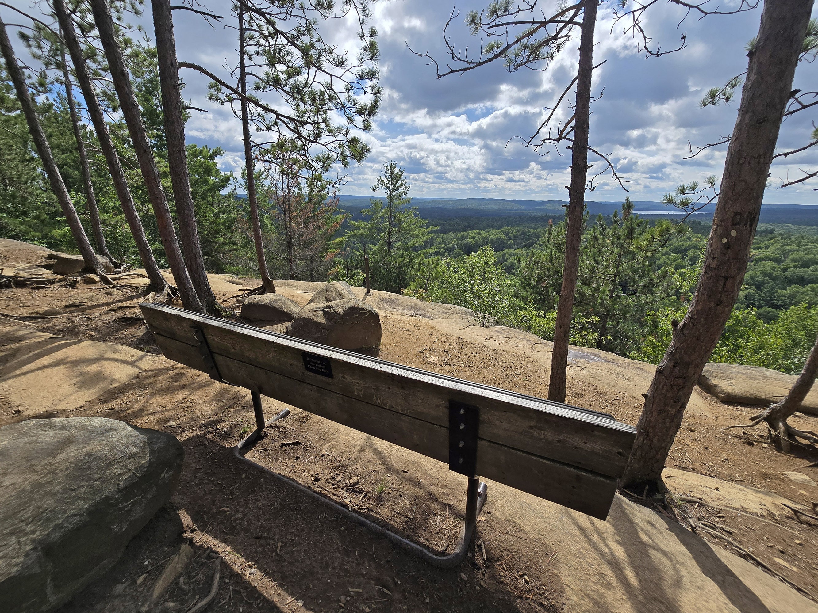 A bench overlooking a cliff, along the Lookout Trail in Algonquin Provincial Park.
