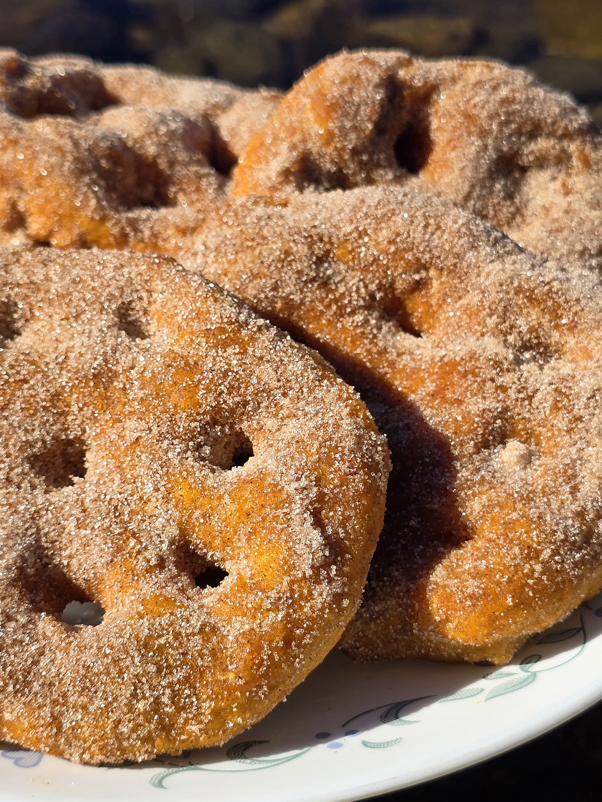 A plate of sugar coated spiced pumpkin frybread.